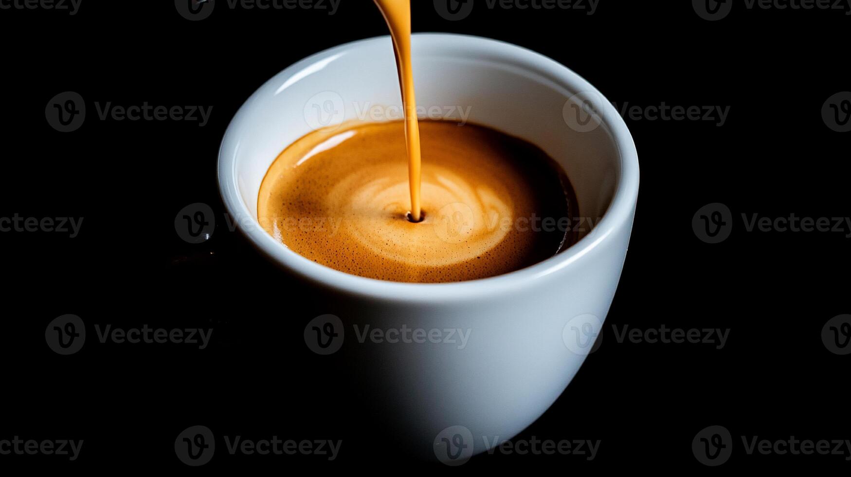 A cup of coffee being poured into it photo