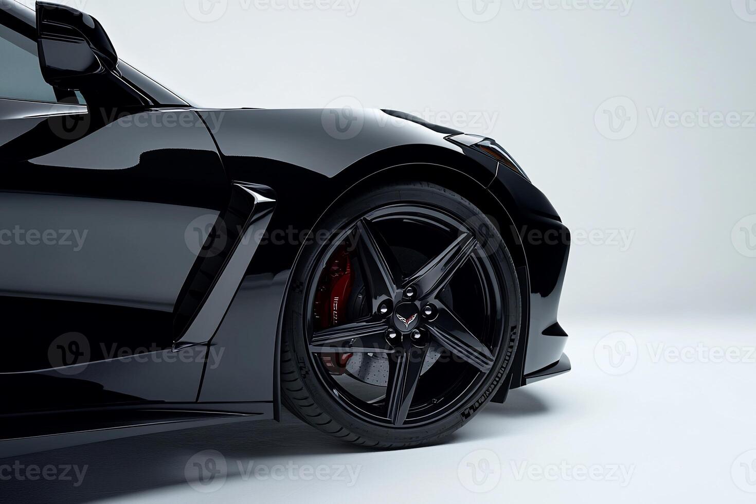 The front wheel of a black sports car photo