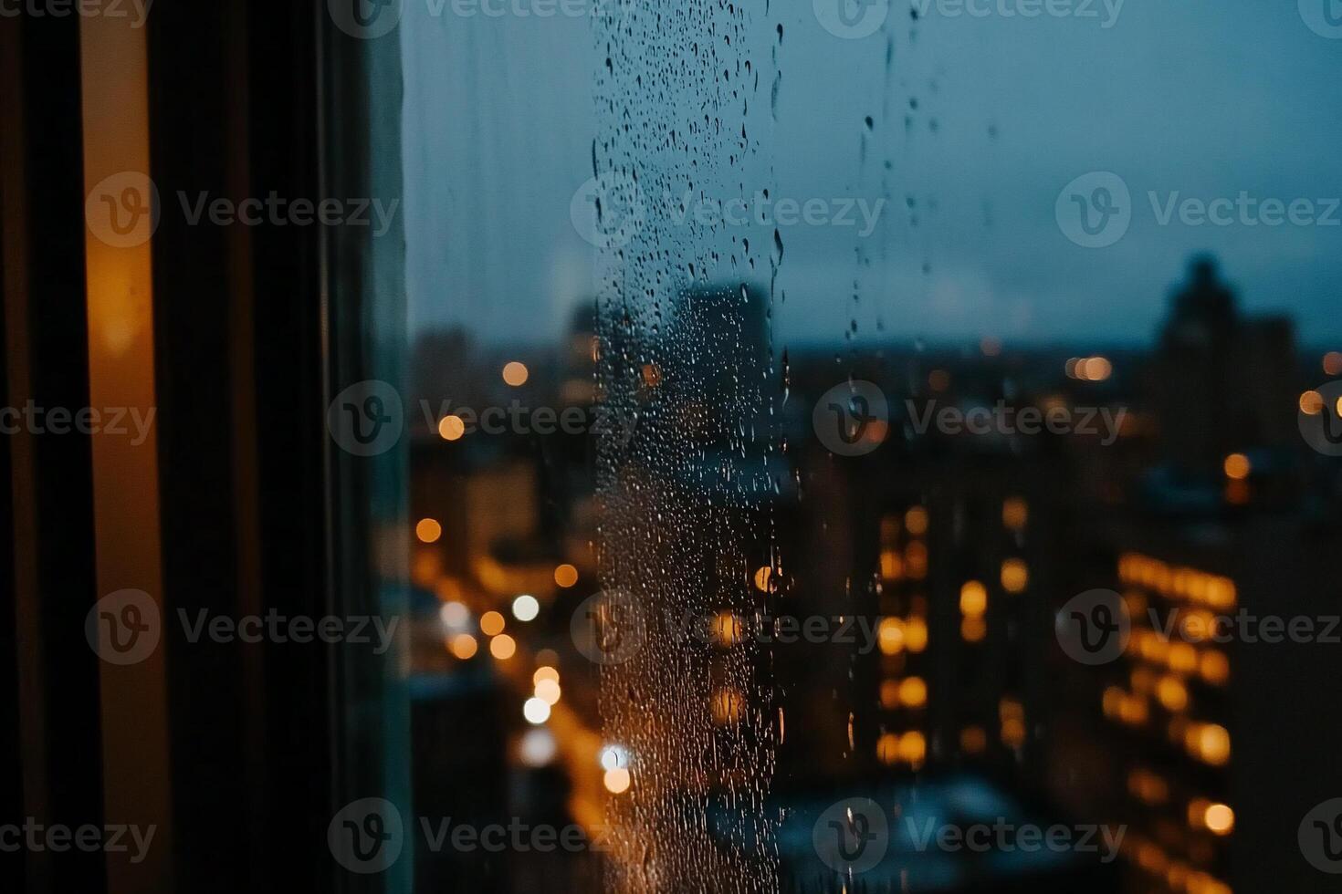 Rainy night city view from a window photo