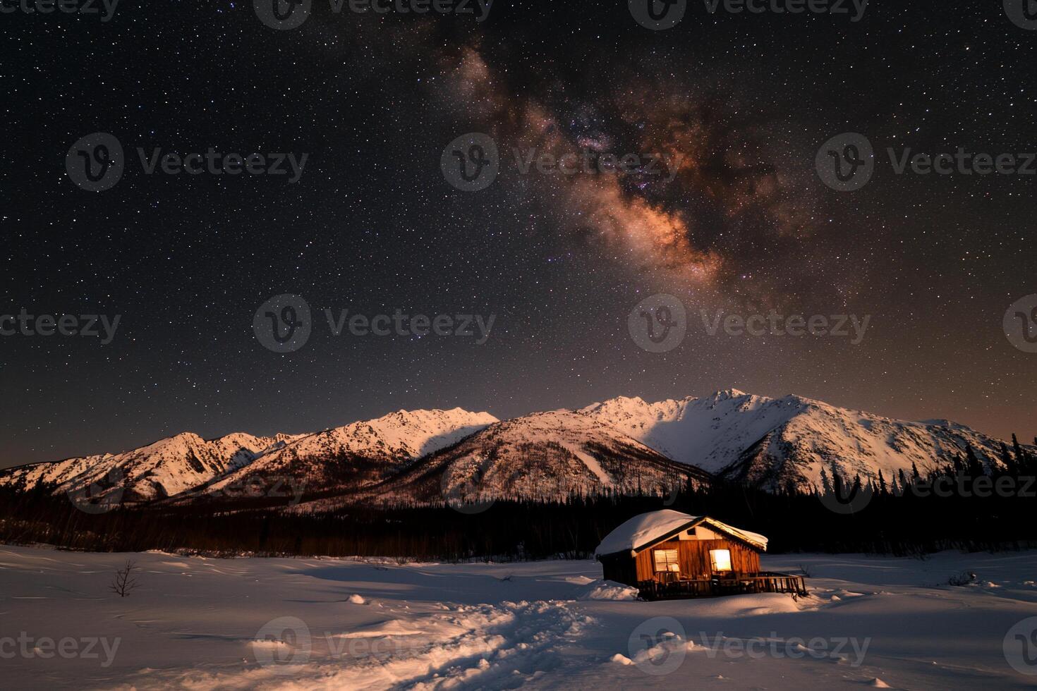 Snowy cabin under a starry night sky photo