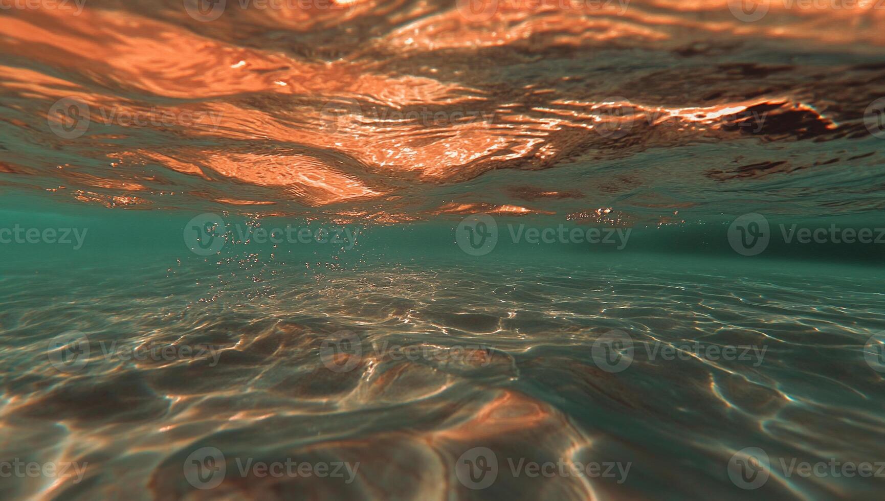 Underwater view of shimmering water photo