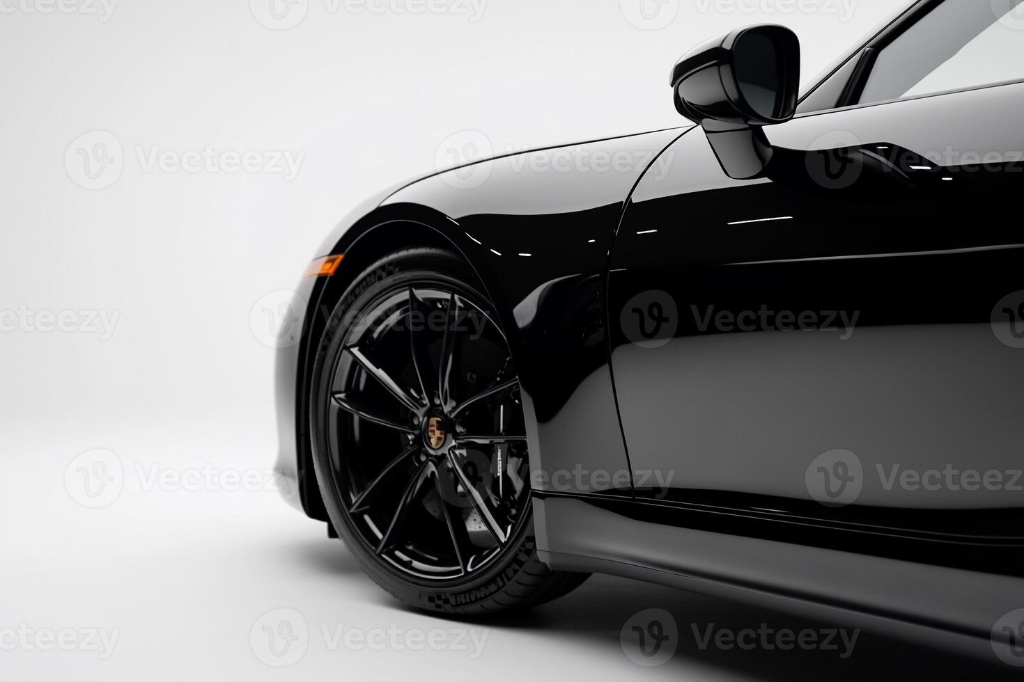 Sleek black sports car side profile. Detailed close-up of wheel and body photo