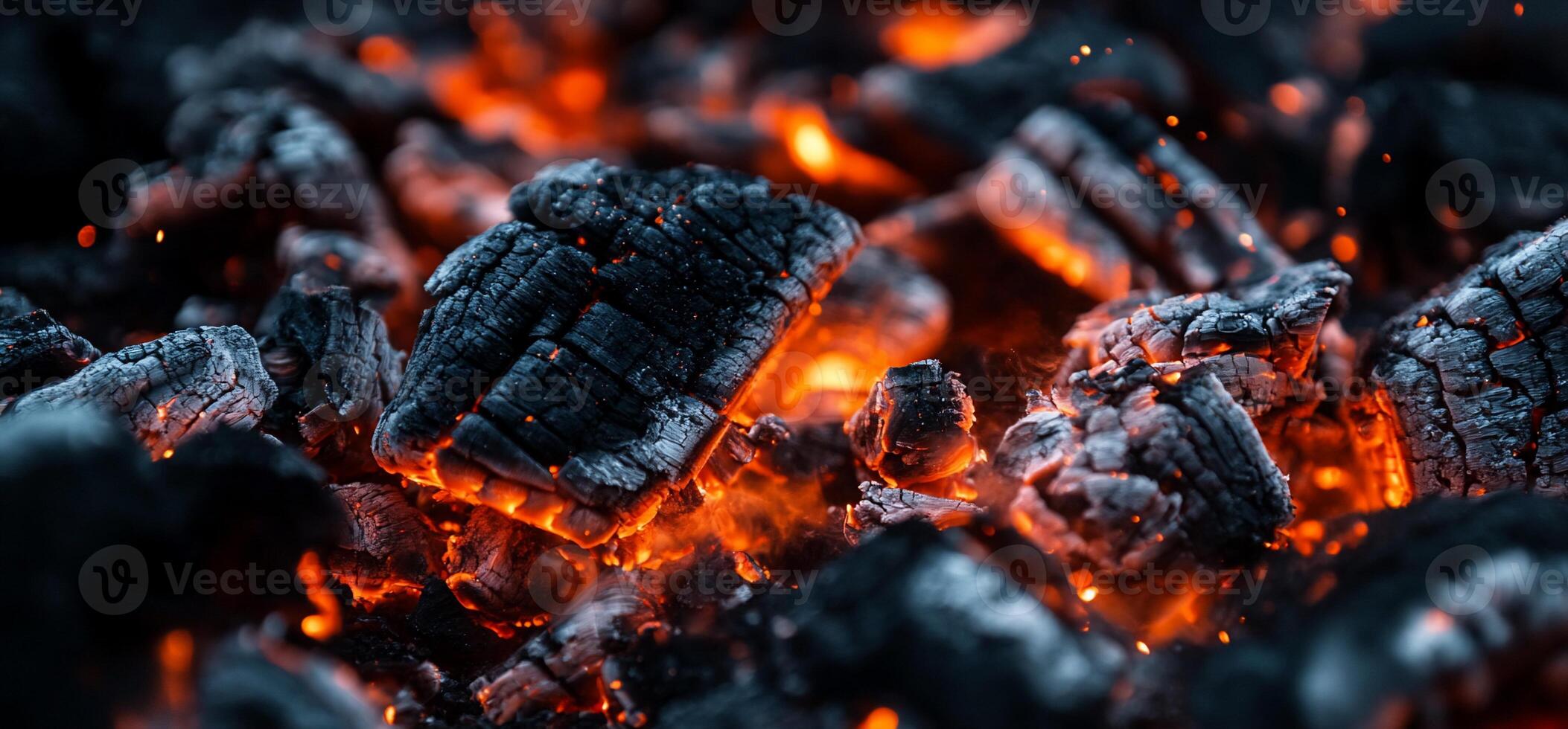 Close up of charcoal burning on a black background photo
