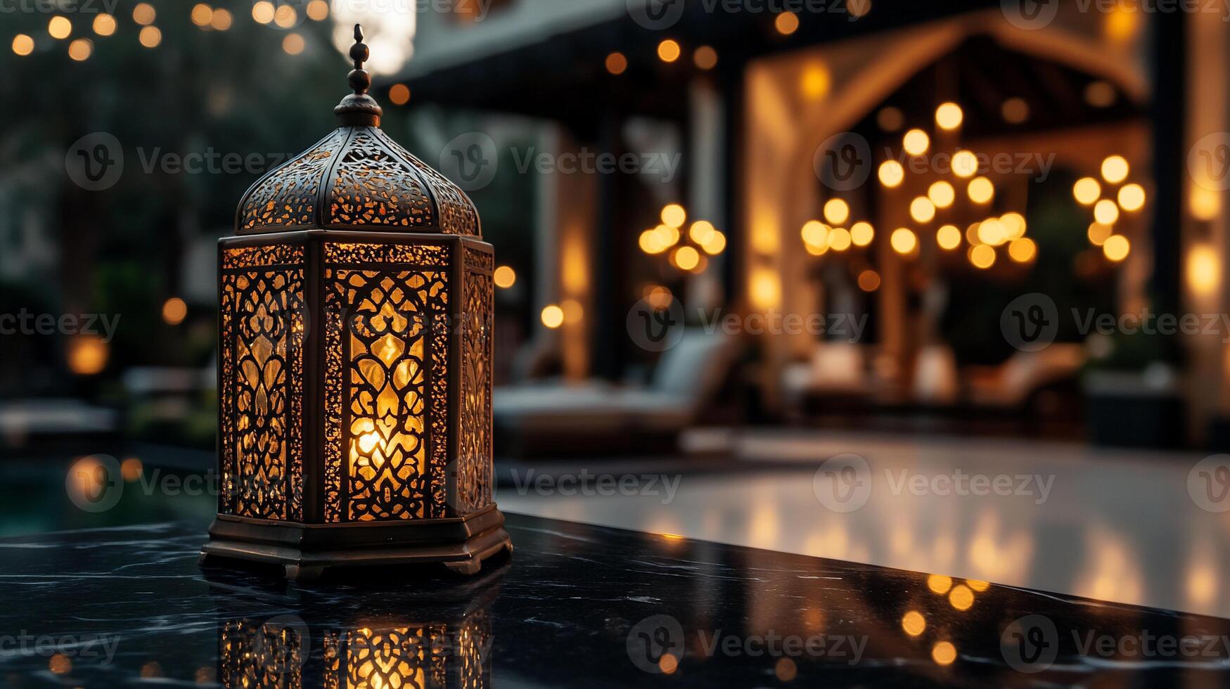 A decorative lantern on a table in front of a pool photo