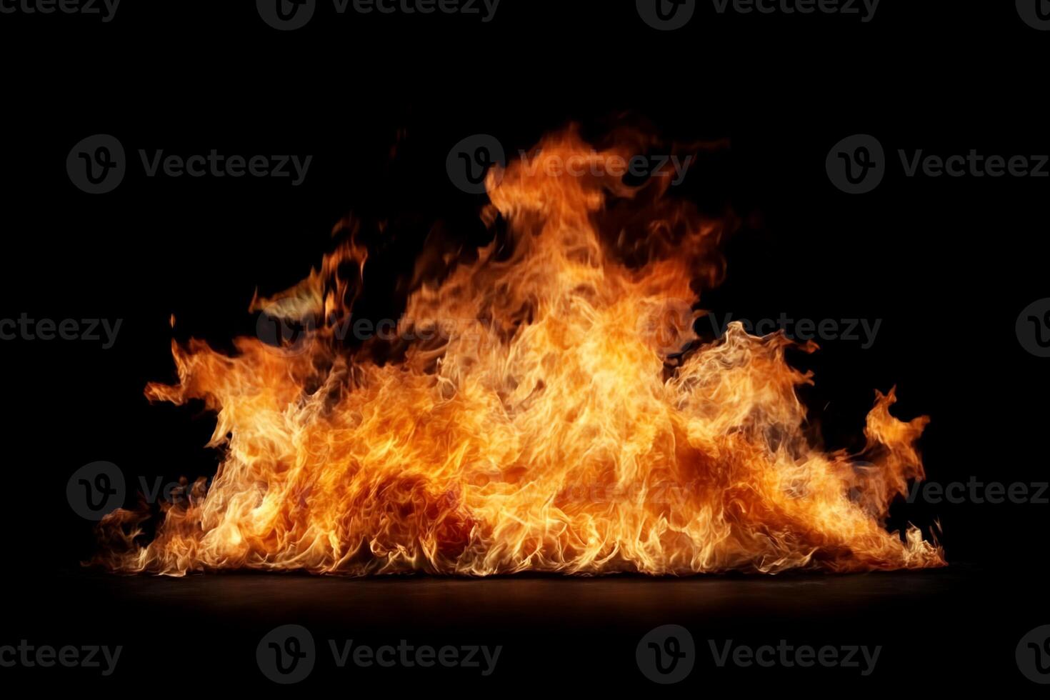 Intense fire flames against a black backdrop. Fierce, orange-yellow flames rising in a dramatic display. Heat radiating from the flames. A captivating image of burning fire photo