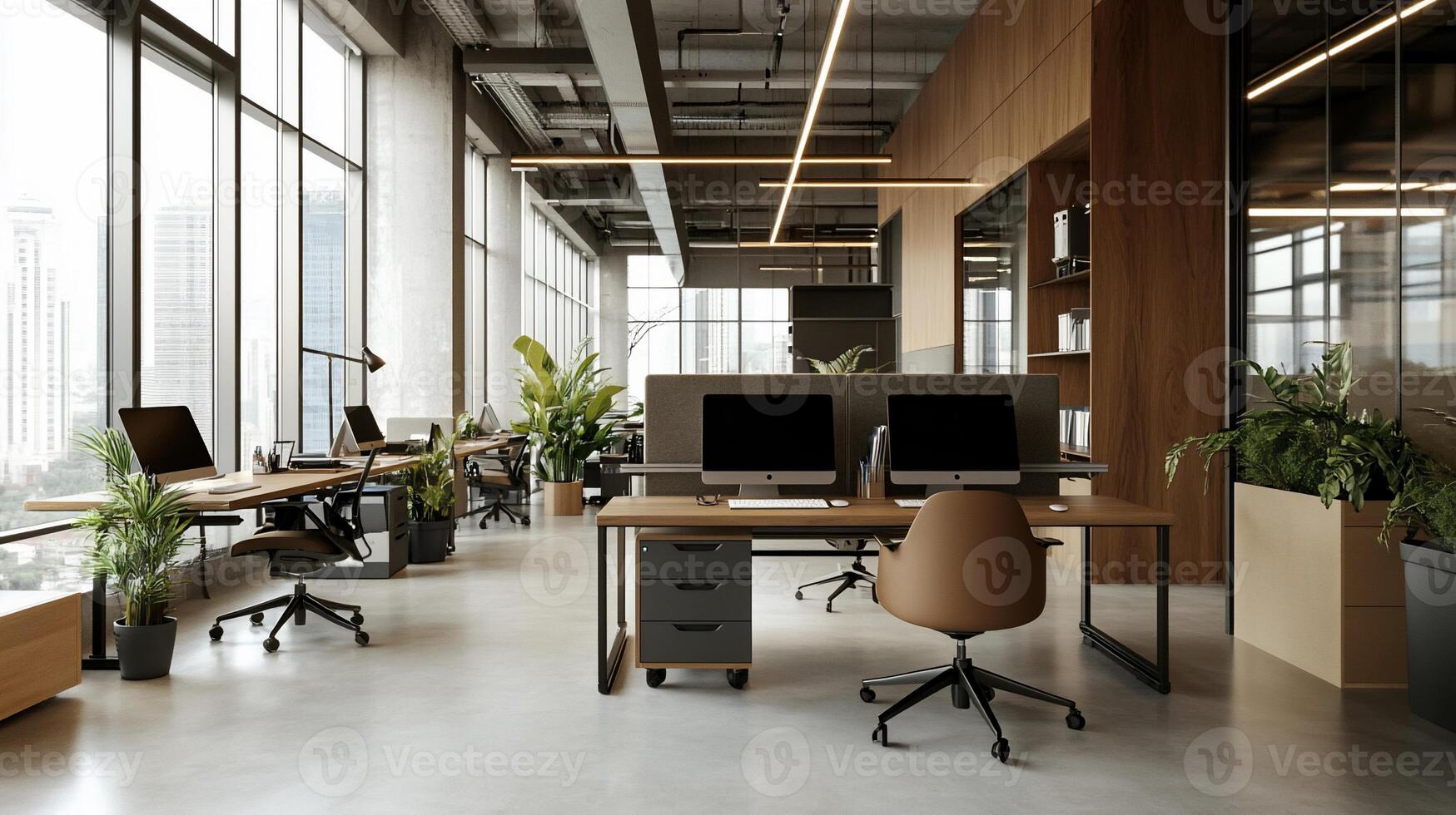 Modern, spacious office space with natural light. Desks, computers, and plants are strategically placed throughout, creating a comfortable and productive environment. Large windows offer city views photo