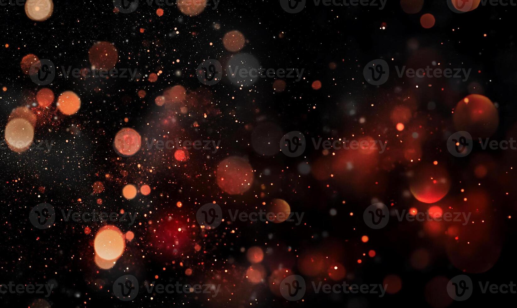 Abstract bokeh lights in warm reddish tones. A dark background is filled with blurred, glowing circles and sparkling dust particles photo