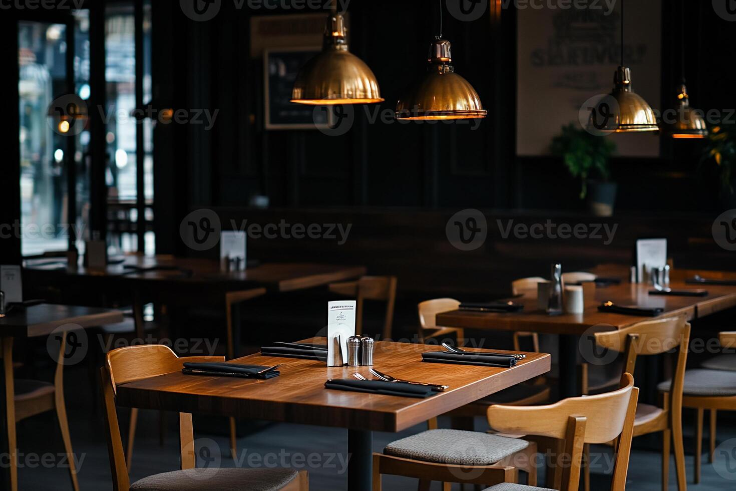 Empty restaurant interior with dark wood tables and chairs. Warm lighting and modern design photo