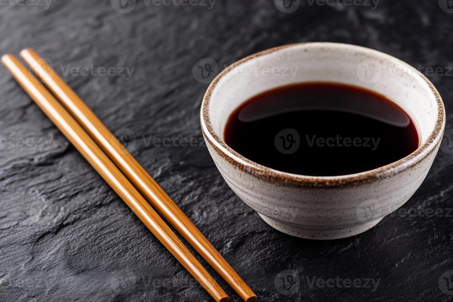 Dark Soy Sauce in Small Bowl with Chopsticks photo