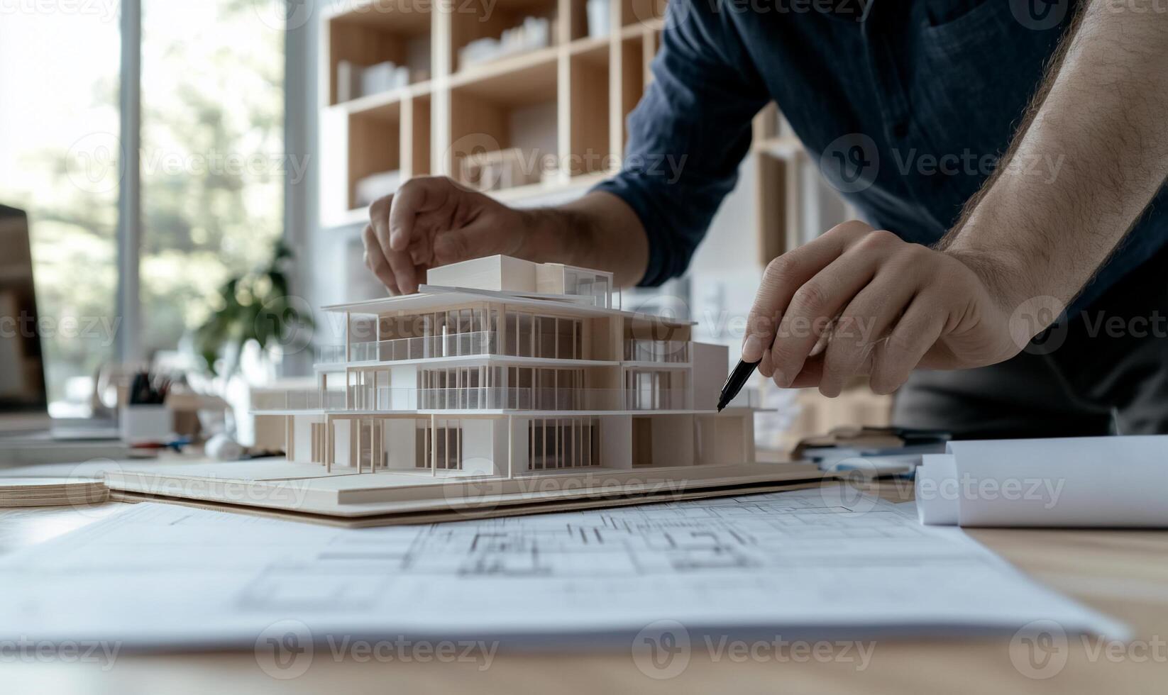 Architect meticulously crafting building model photo