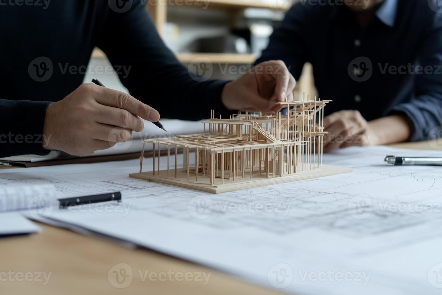 Architects reviewing architectural model photo