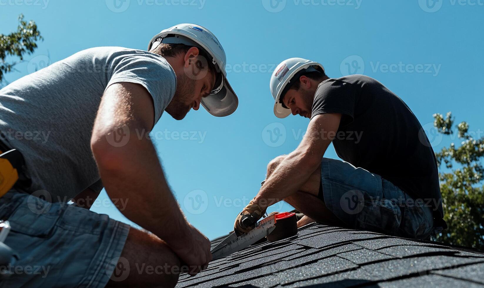 Two men working on a roof photo
