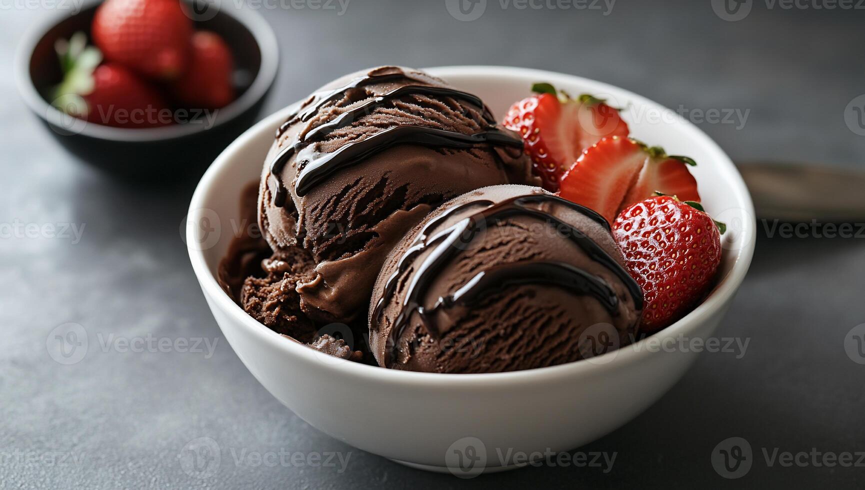 Chocolate ice cream scoops with strawberries photo