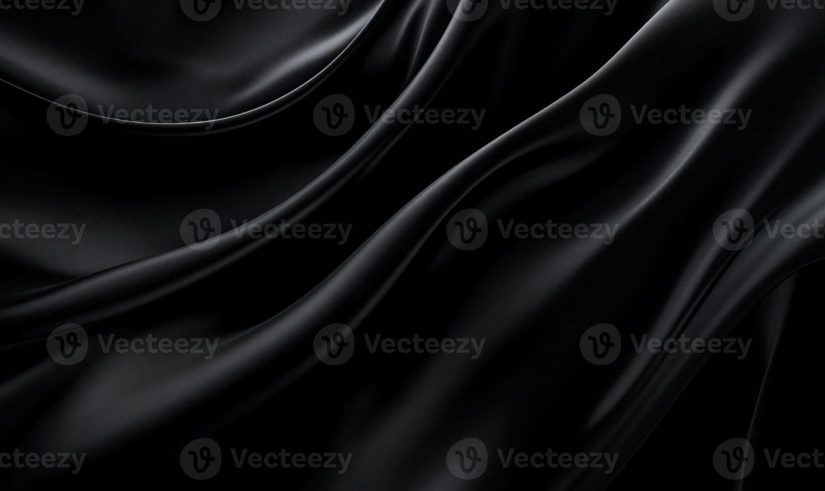 Smooth, dark fabric with elegant folds and soft sheen photo