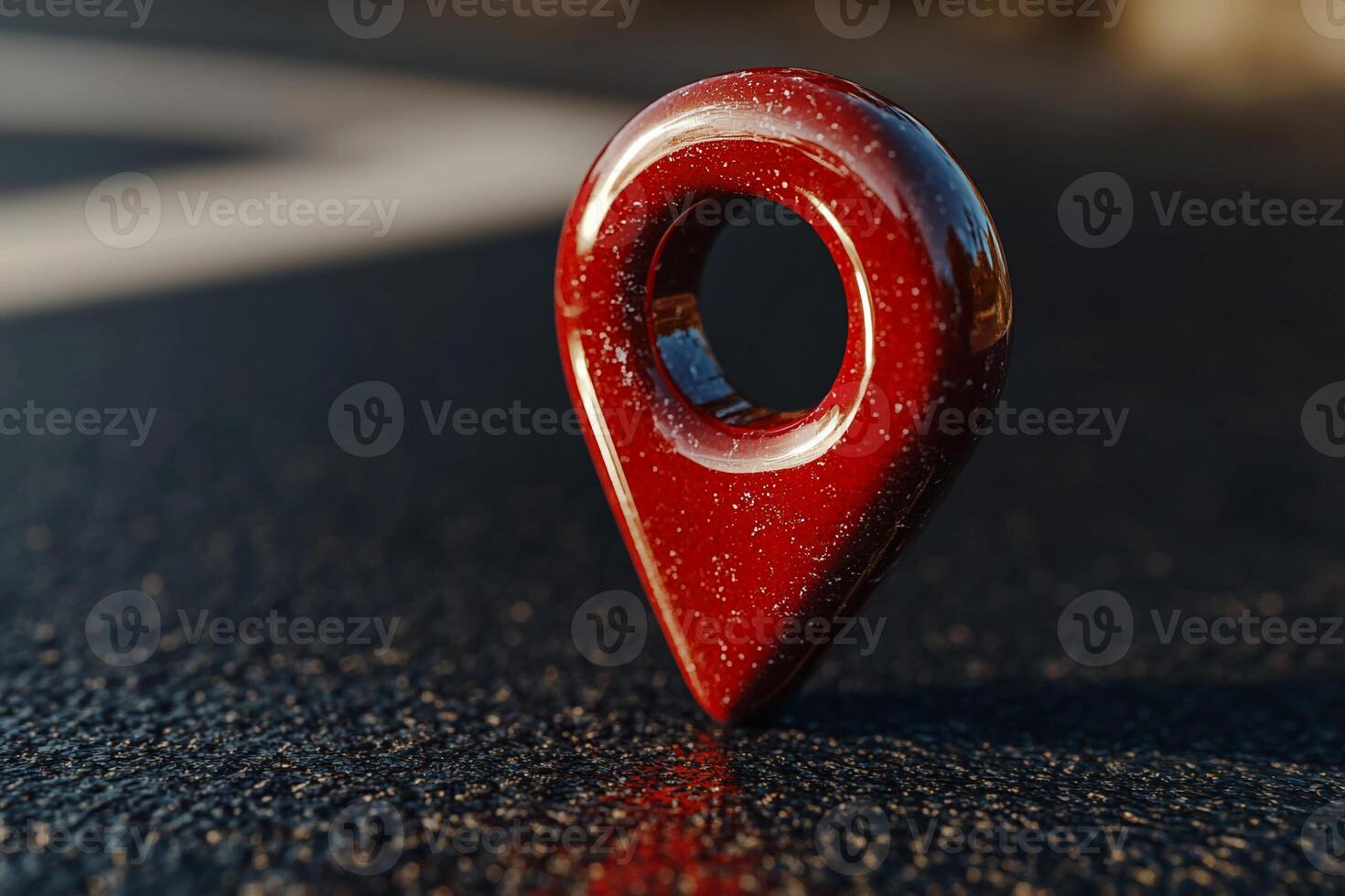 Red location marker on dark surface photo