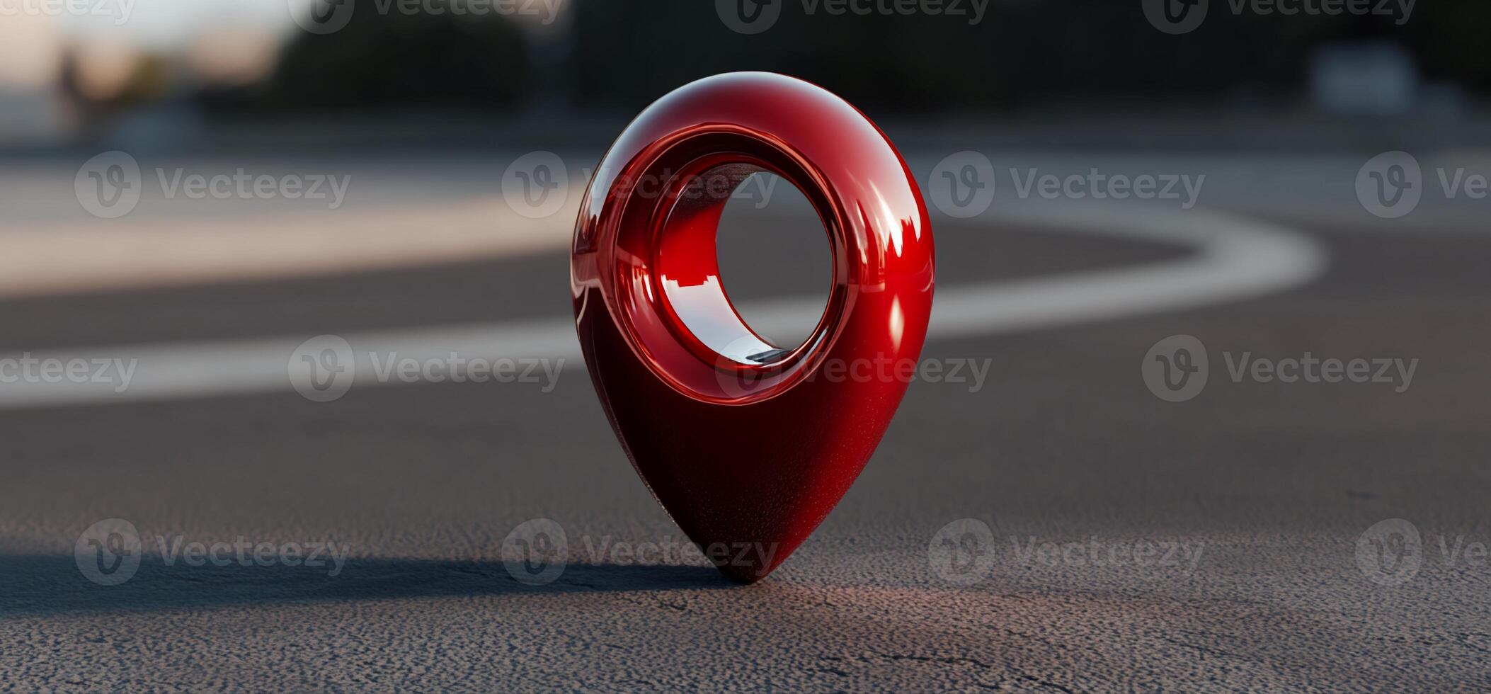 Red glossy location marker on asphalt photo