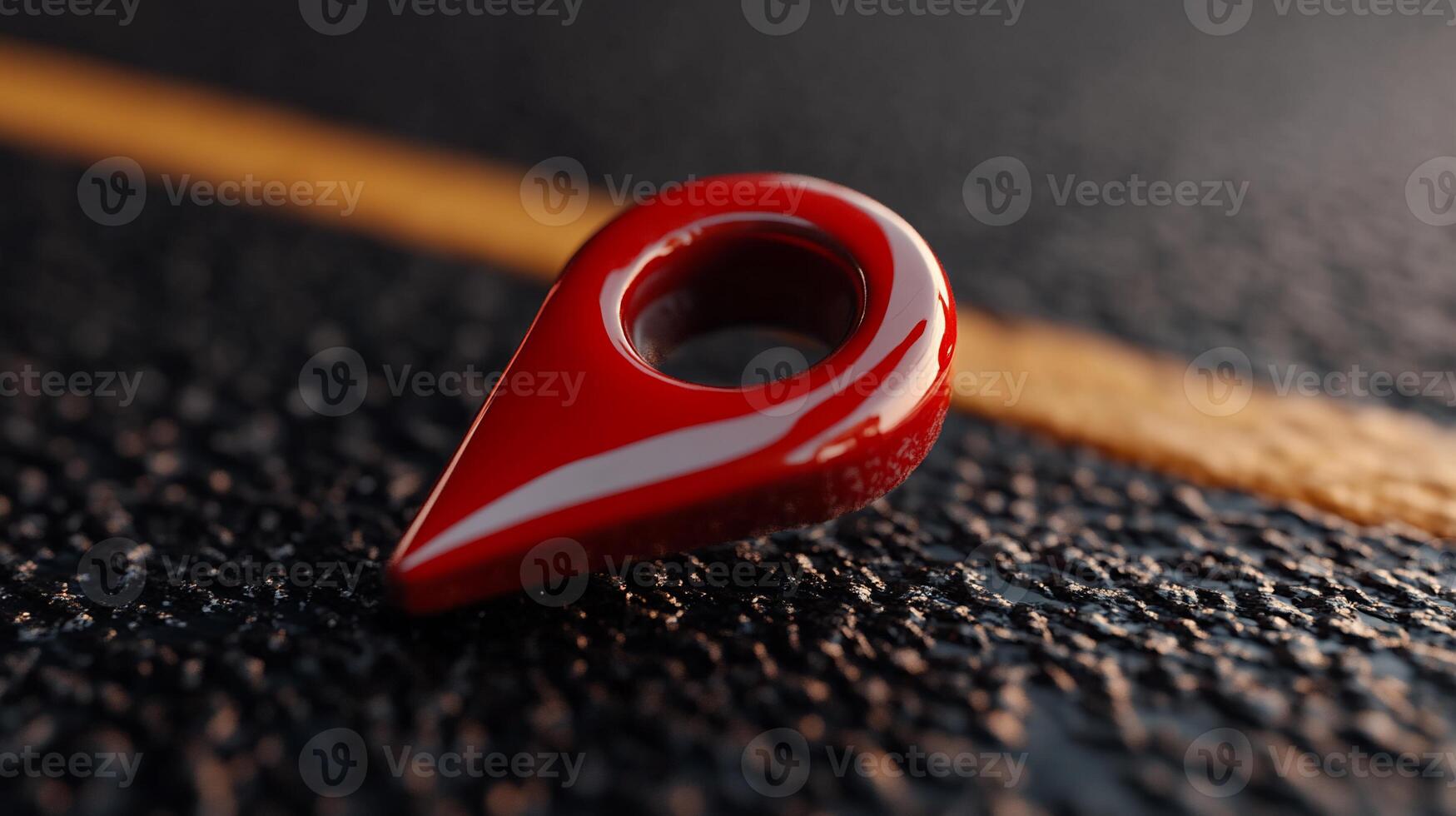Glossy red map pin on dark asphalt photo