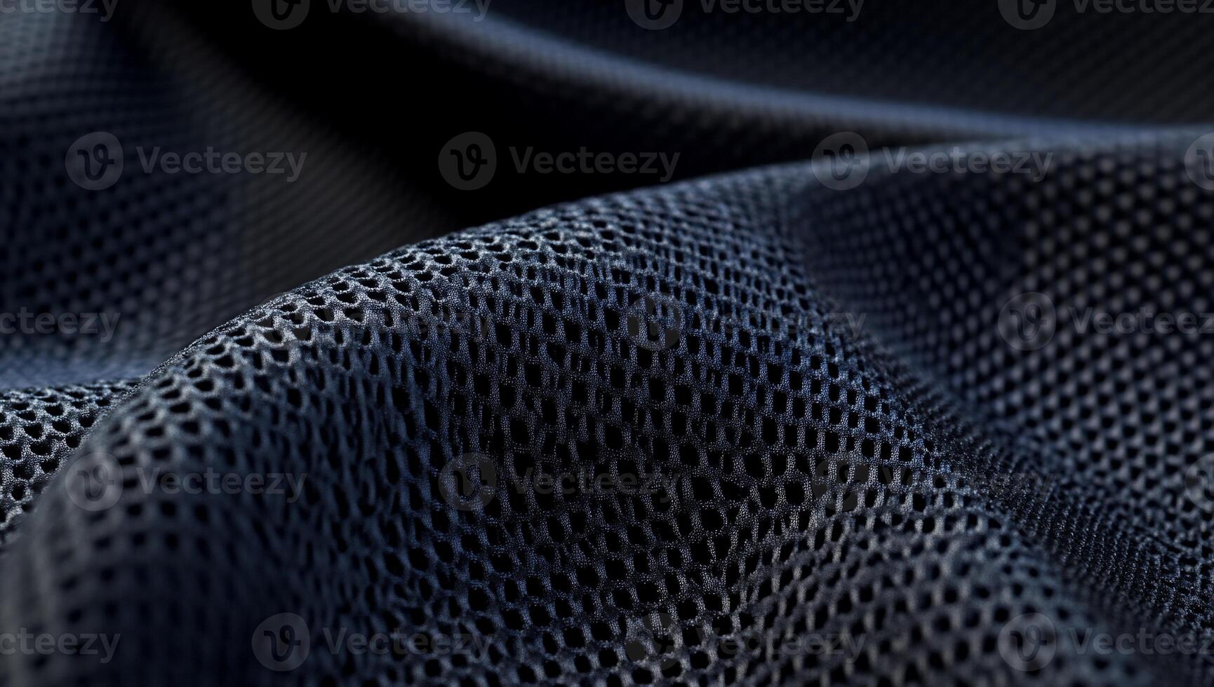 Dark gray mesh fabric with subtle waves and textured surface photo