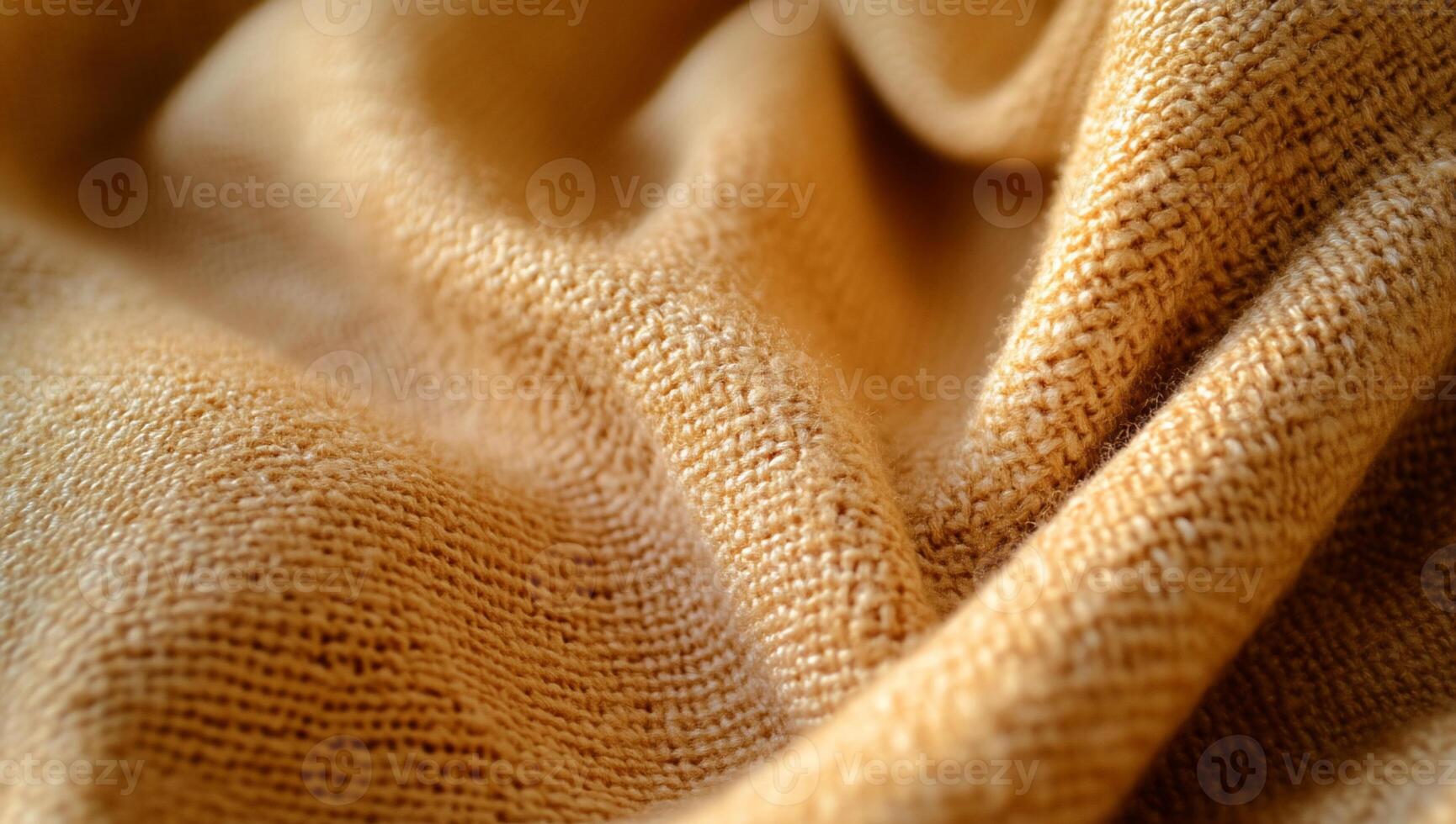 Soft, textured beige fabric with subtle folds and warm lighting photo