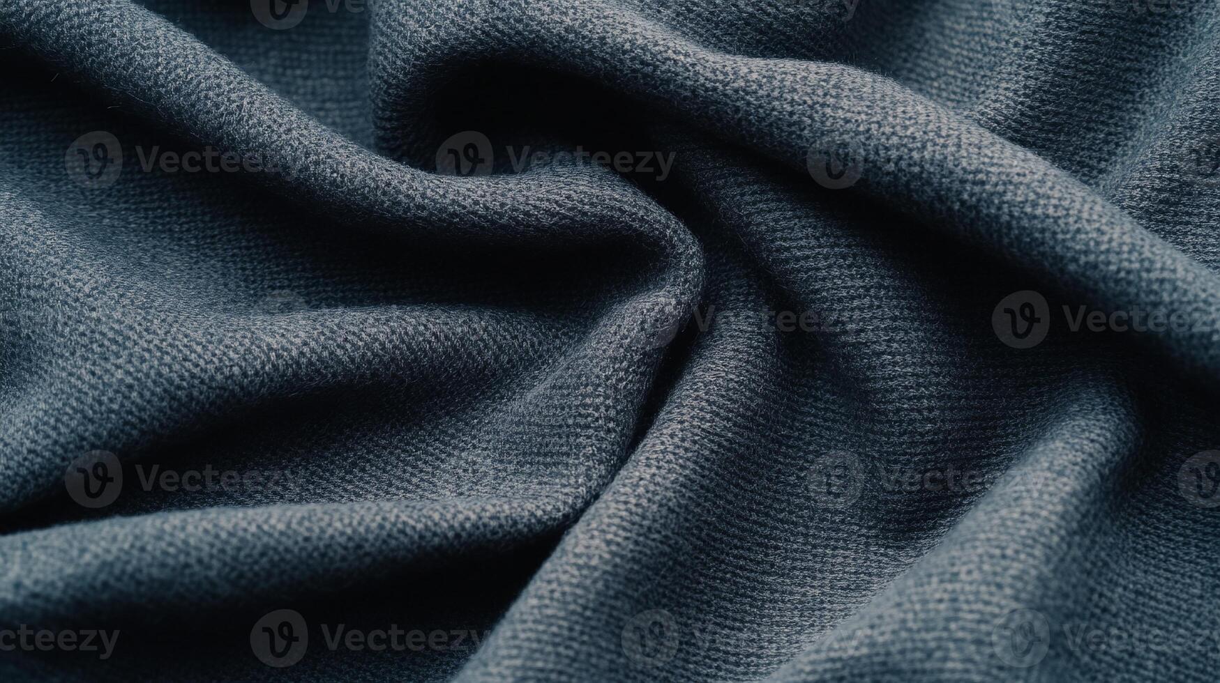 Draped dark grey fabric with textured weave photo