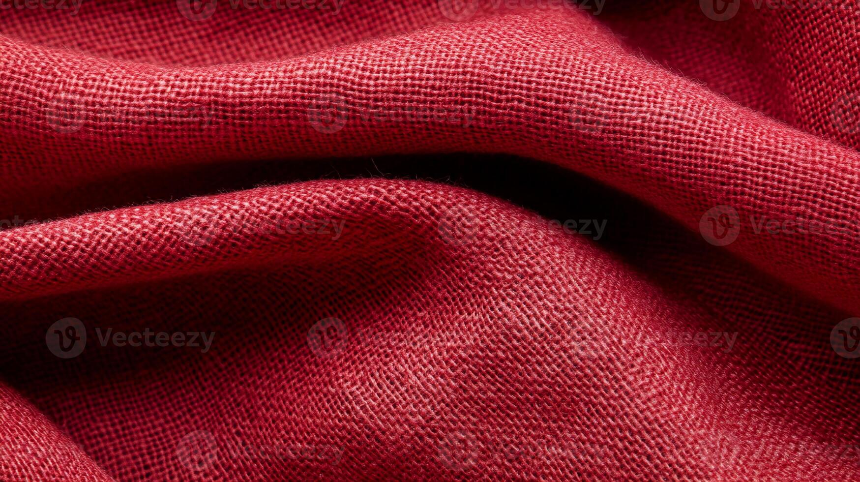 Draped crimson fabric with textured weave photo