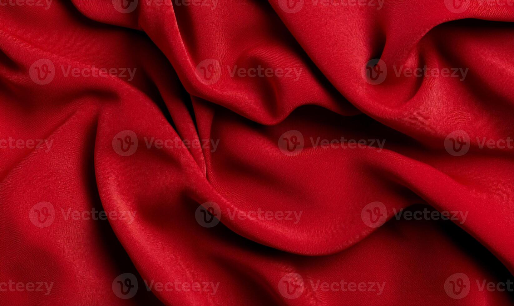 Rich crimson fabric, softly draped, showing elegant folds and texture photo