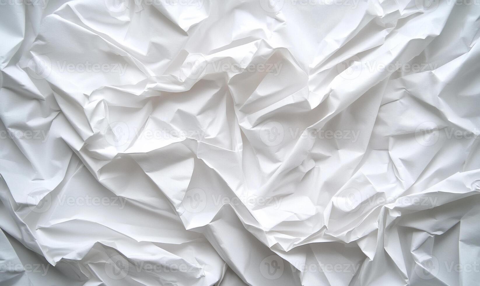 Abstract textured white fabric with deep folds and creases photo