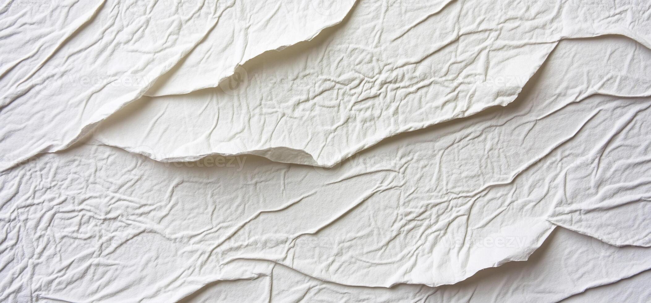Layered, textured white surface with creased, wrinkled pattern photo