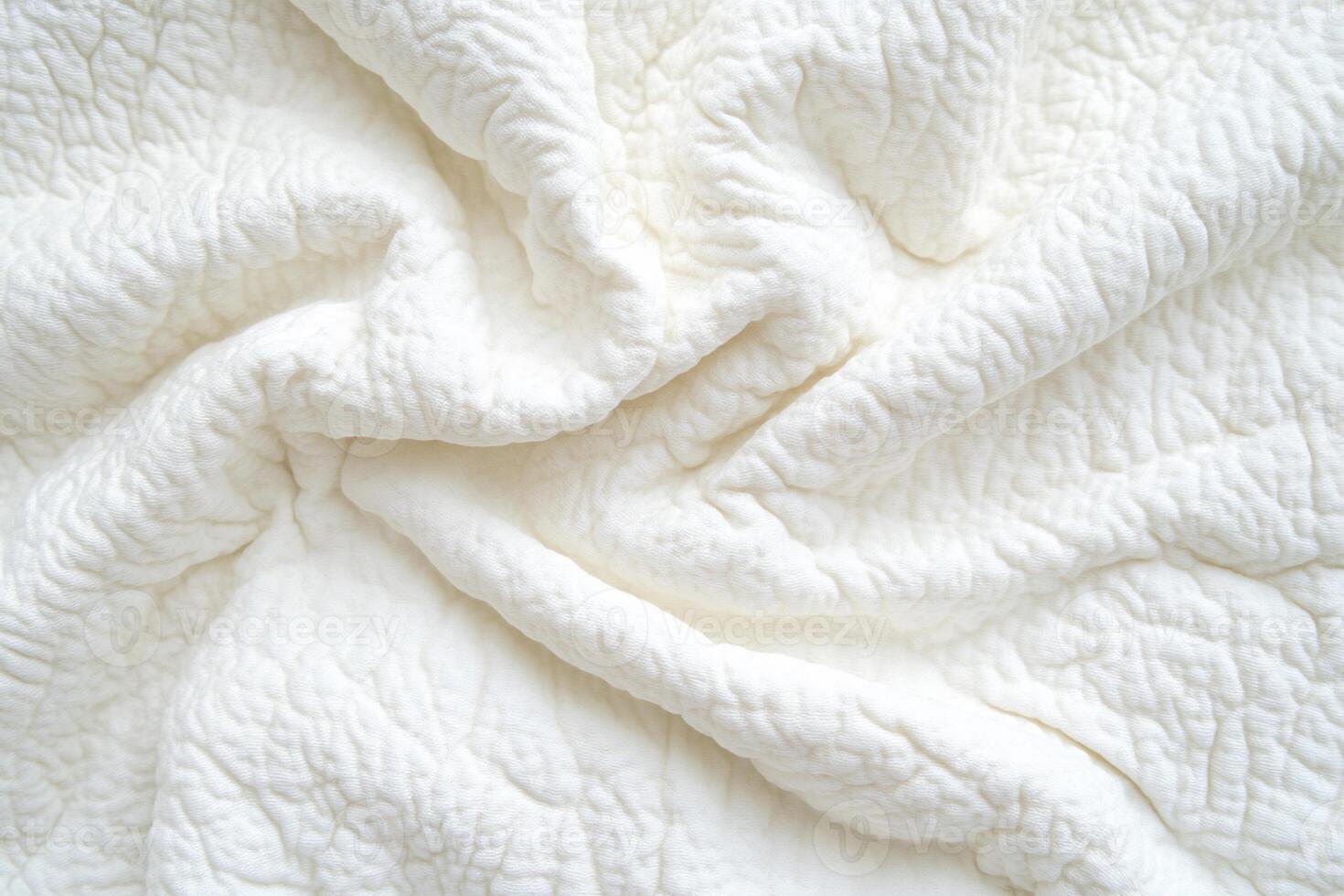 Soft, textured white fabric in a swirling pattern photo