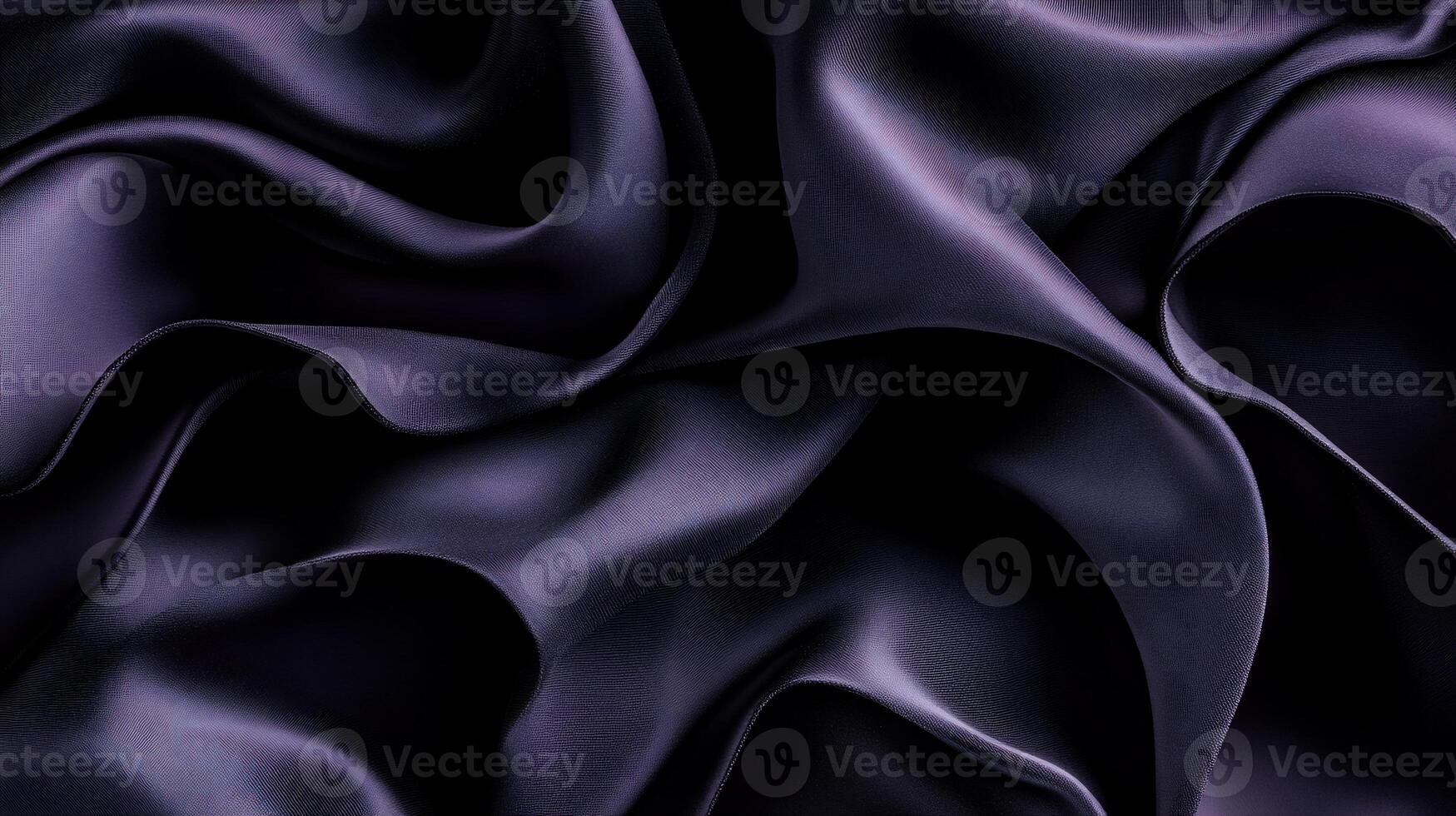 Luxurious dark purple silk fabric, elegant drapes and folds photo