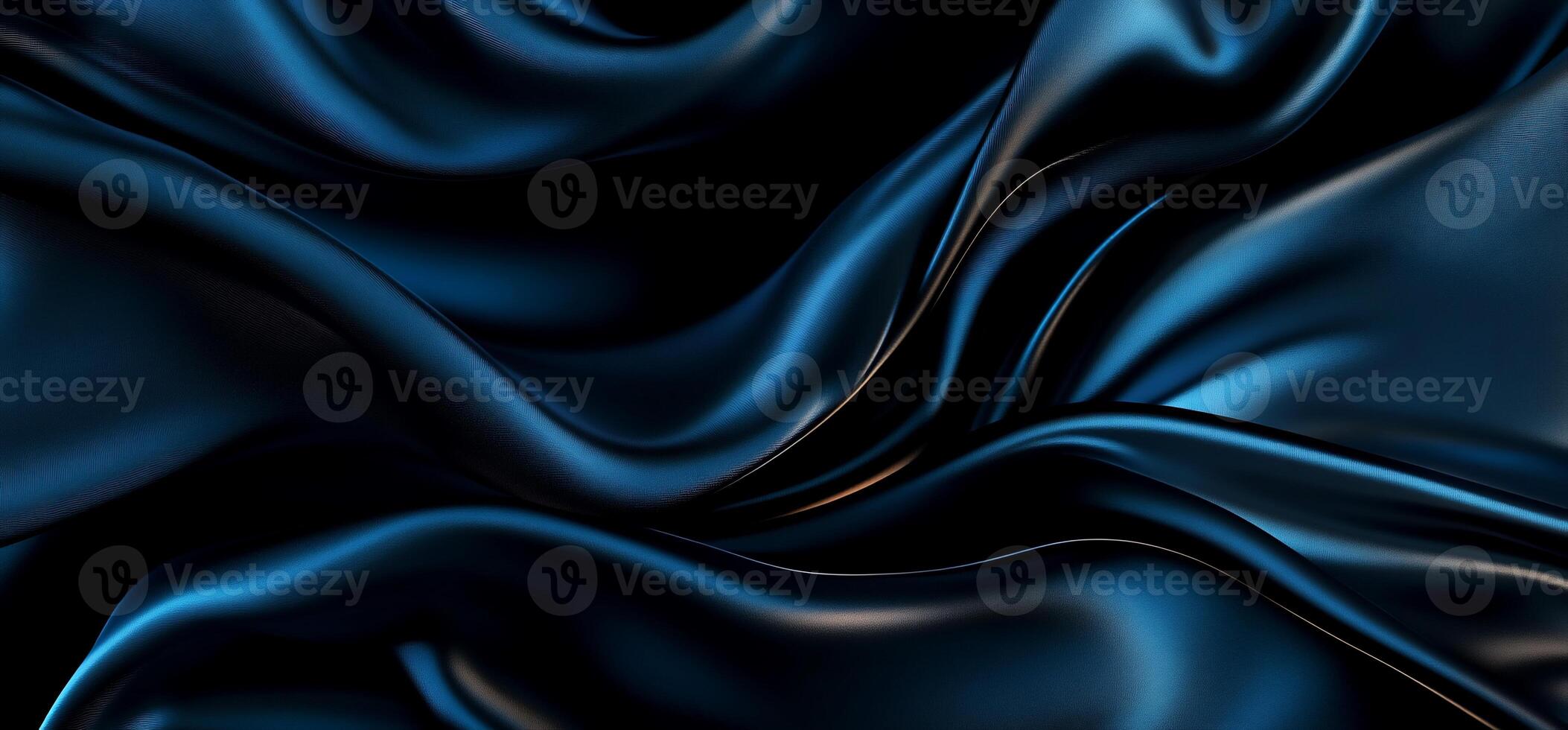 Dark blue silk fabric with elegant flowing folds and luxurious texture photo