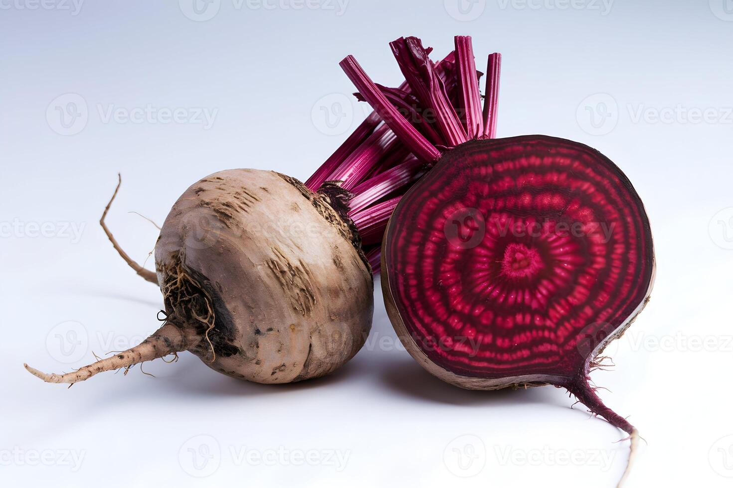 Fresh beetroot halved to reveal concentric red rings, with vibrant textures and detail photo