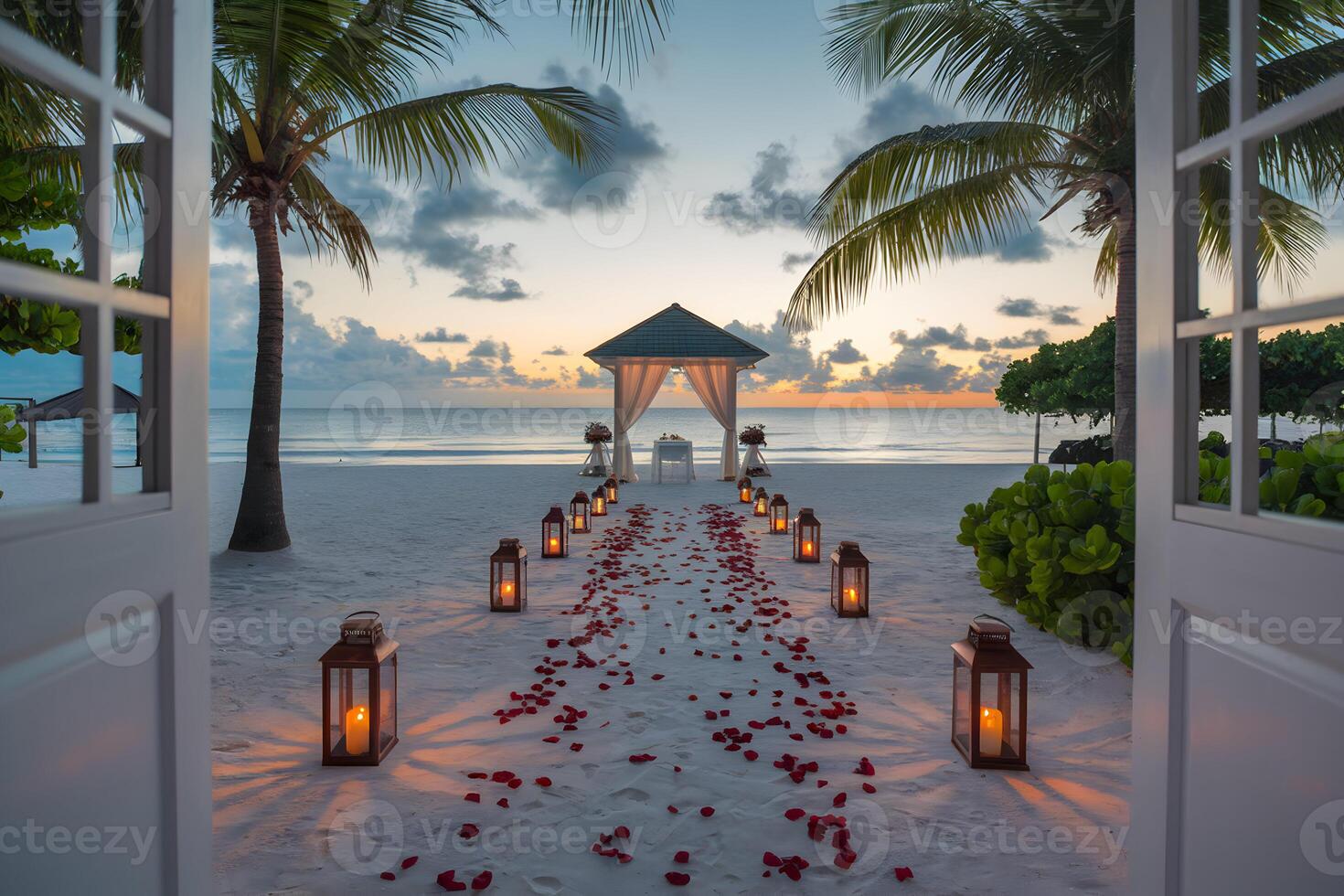 Beach sunset scene framed by open door, romantic lanterns, and rose petals photo