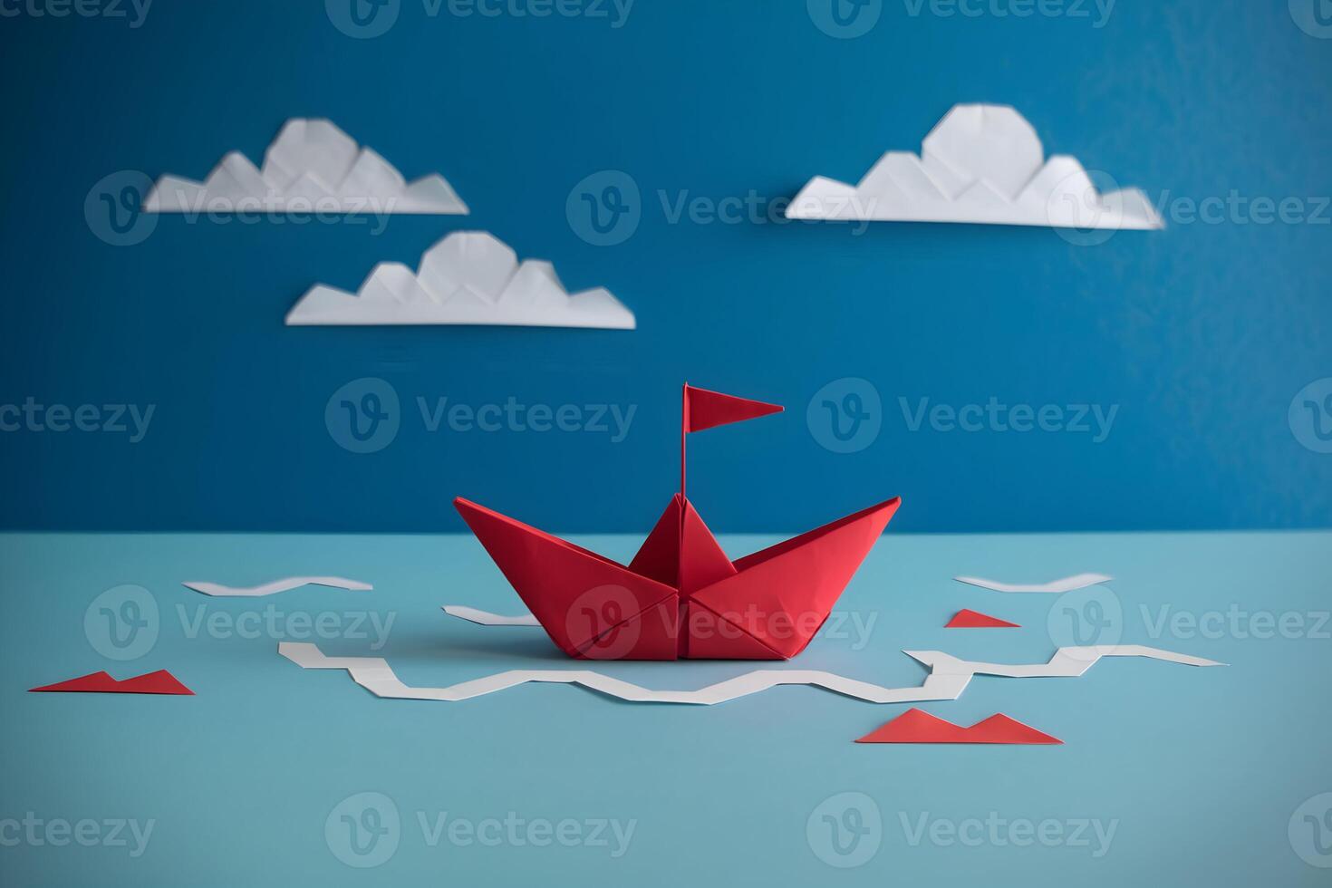 Red origami boat with a flag sails on a smooth surface, evoking creativity and exploration photo
