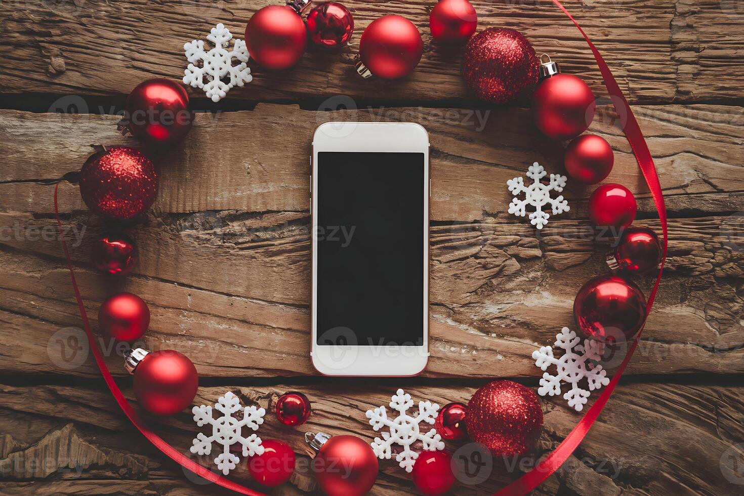 Smartphone on rustic wood encircled by festive baubles, snowflakes, and ribbons photo