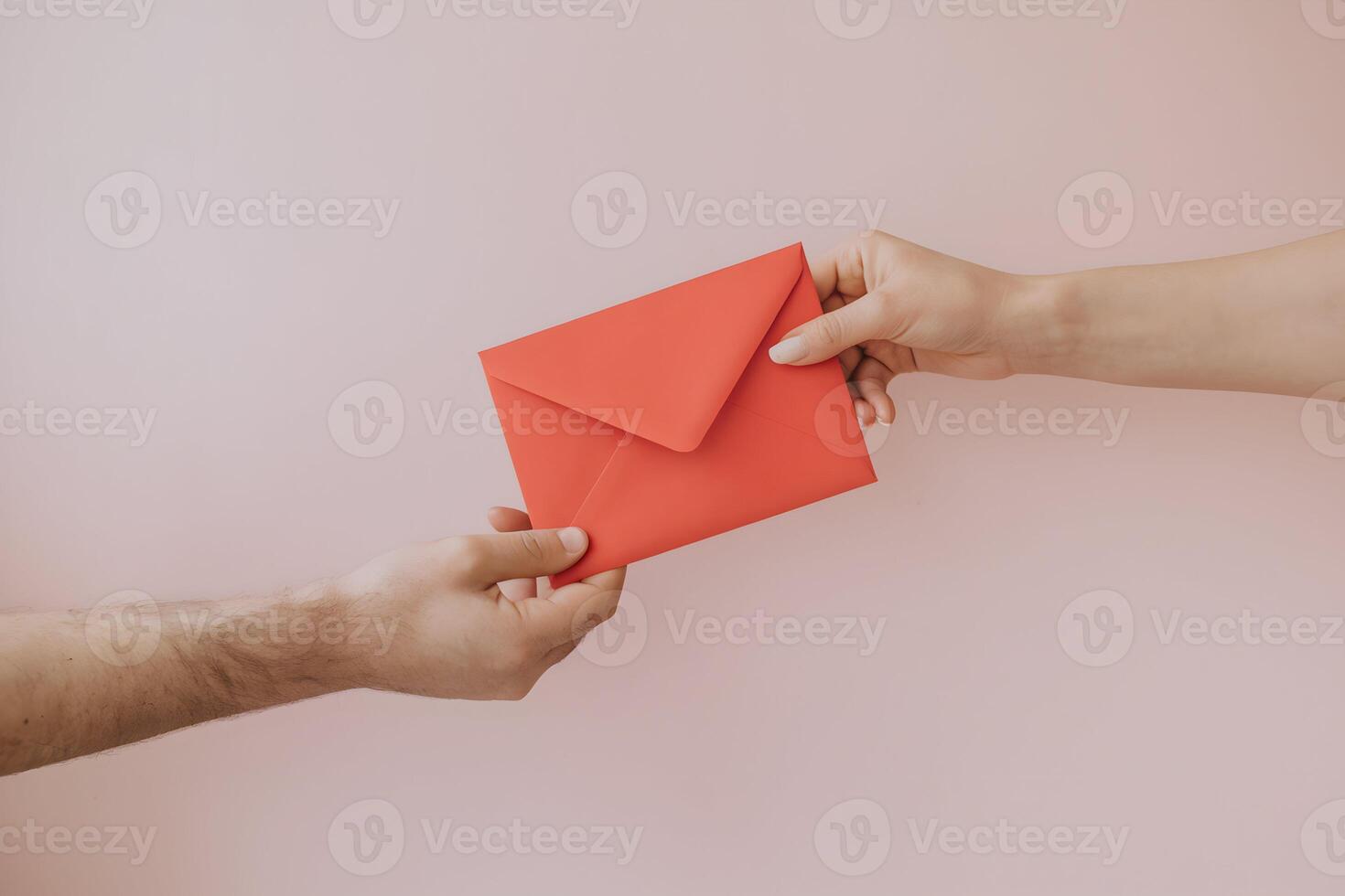 Hands exchanging a red envelope against a pastel pink background photo