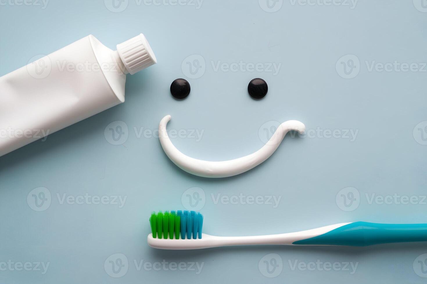 A toothpaste smiley face with a toothbrush and toothpaste tube photo