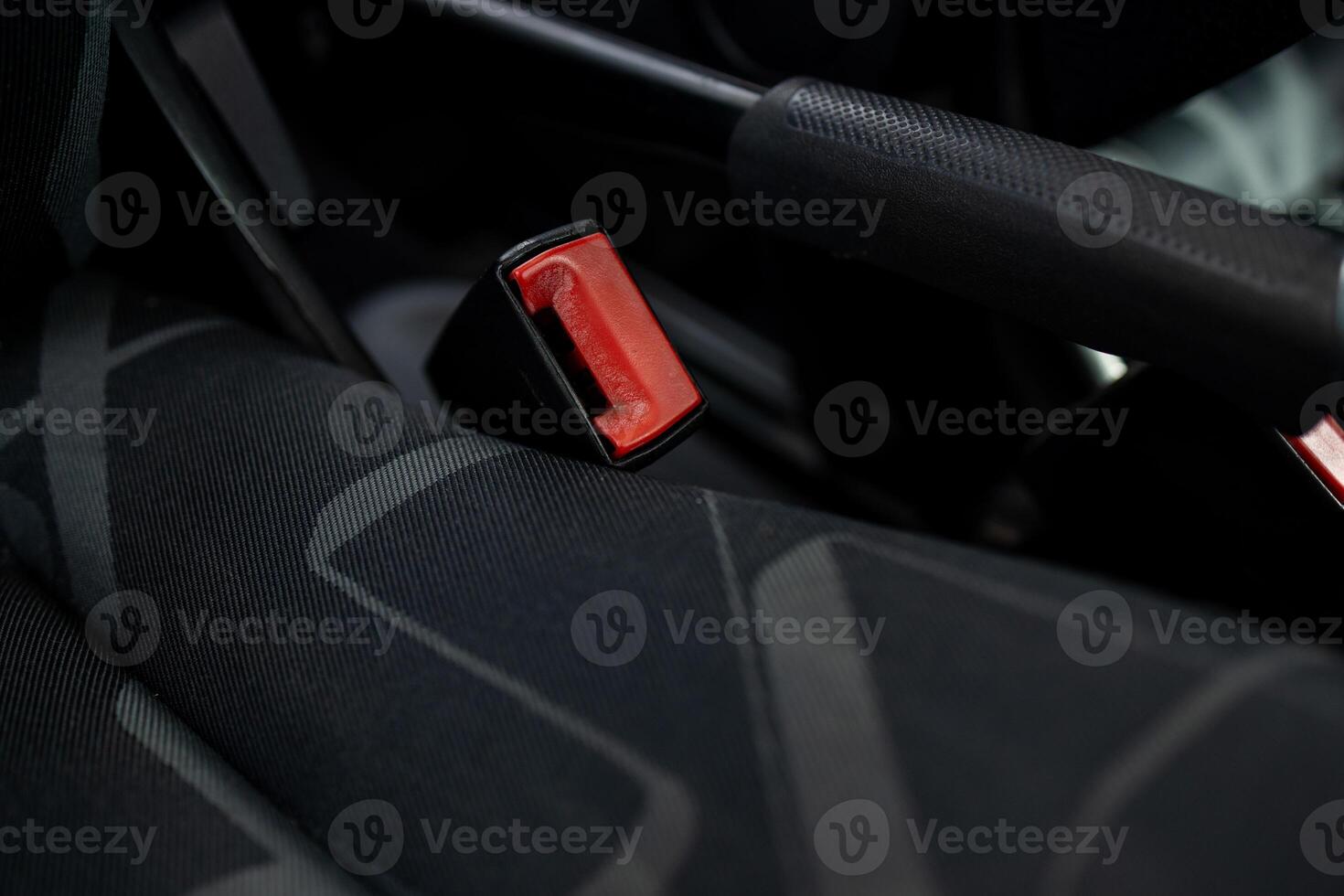 Car seatbelt buckle, close-up view. Car seatbelt buckle, close-up, red button. photo