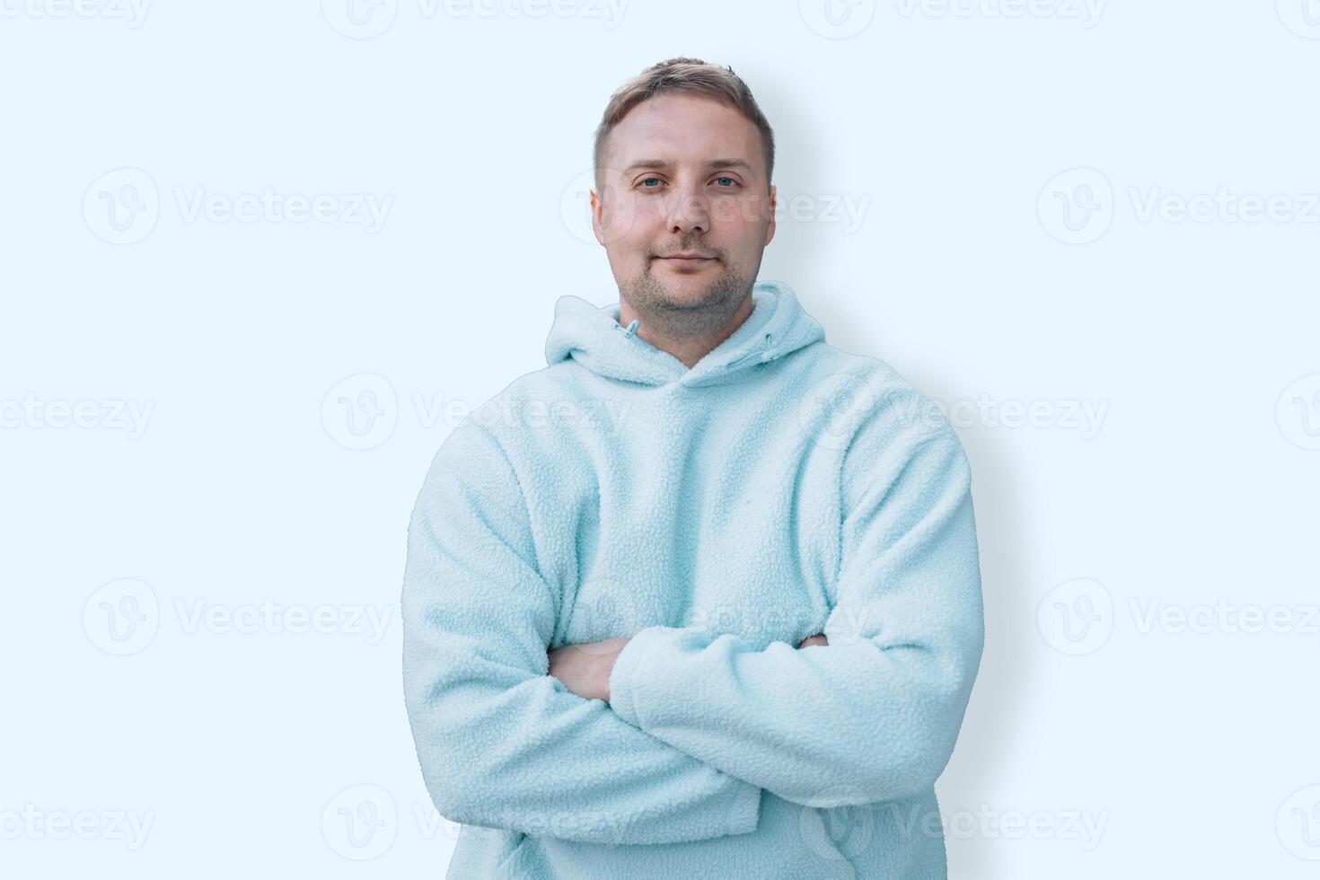 Young caucasian smiling happy cheerful bearded attractive handsome student man 20s wearing casual blue hoodie looking camera isolated on blue background studio portrait People lifestyle concept photo