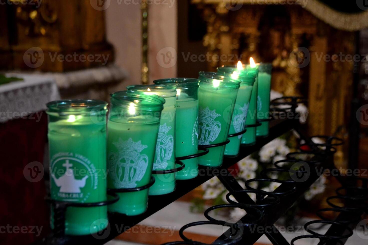 Holy week celebration in Spain with illuminated candles in church setting photo