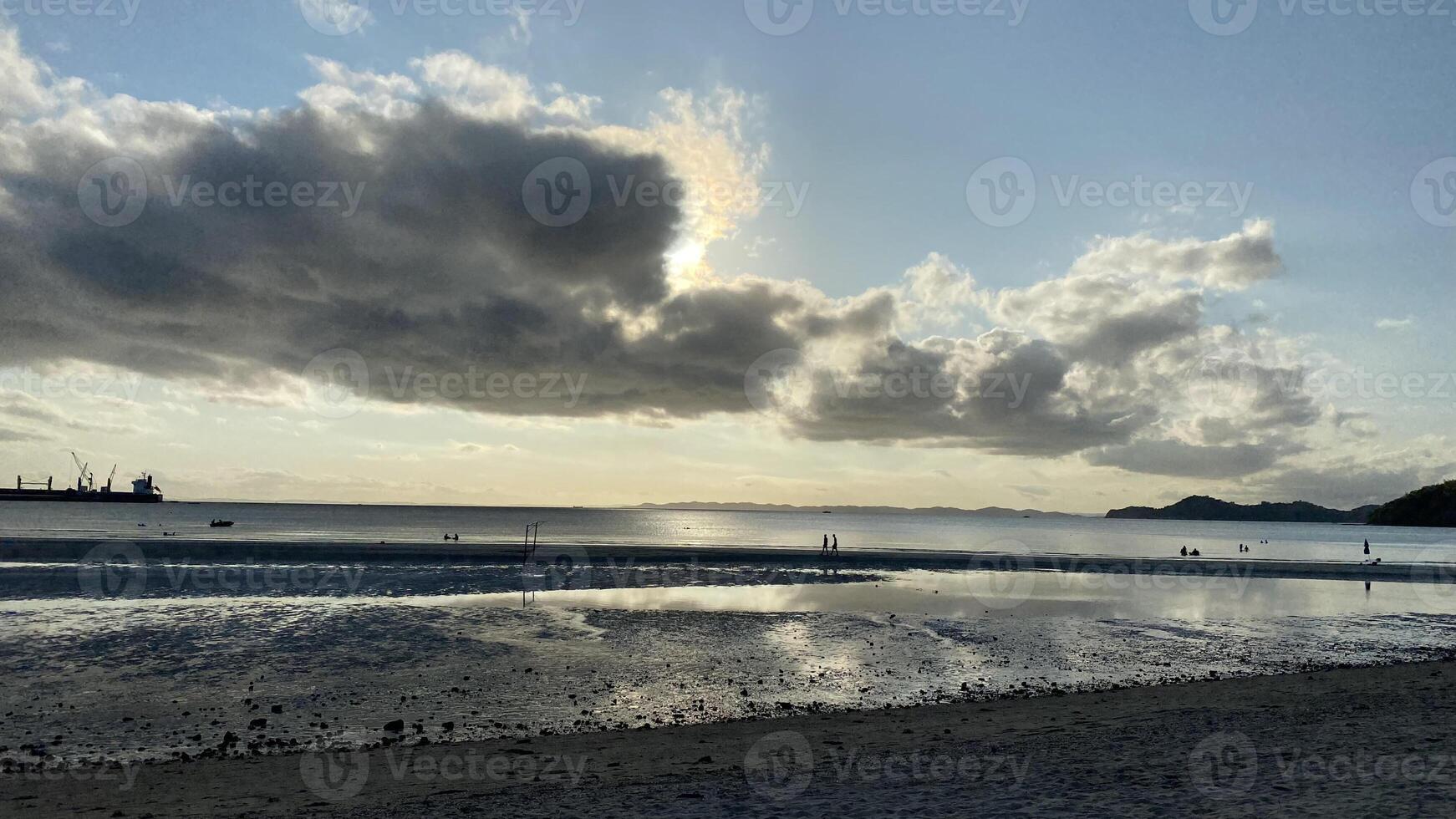 beach sunset clouds ocean sand photo