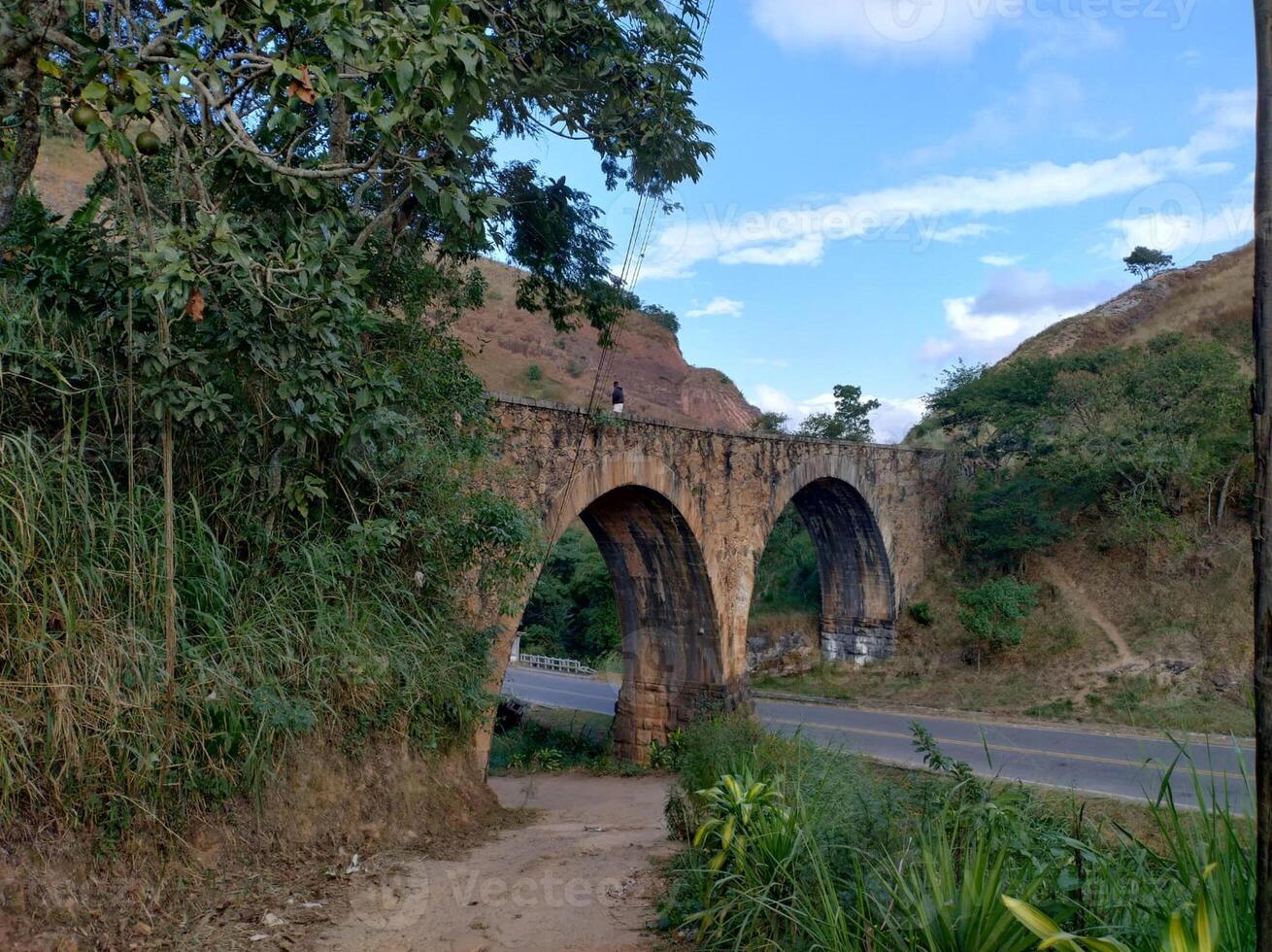 old stone bridge green landscape photo