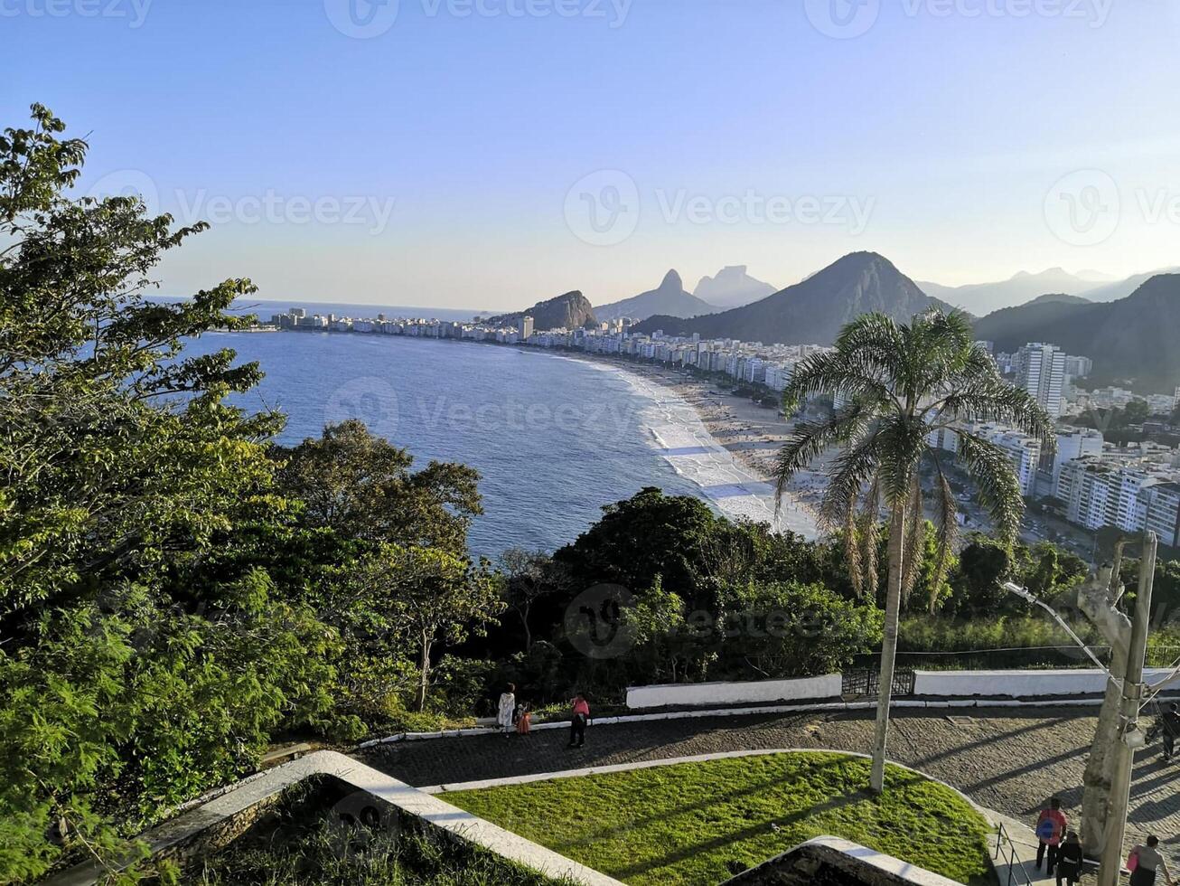 beach city ocean mountain sunset trees palm view photo