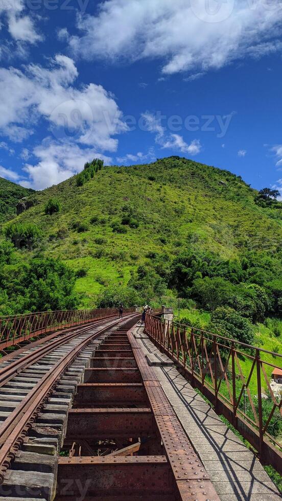 railway bridge green hill nature photo