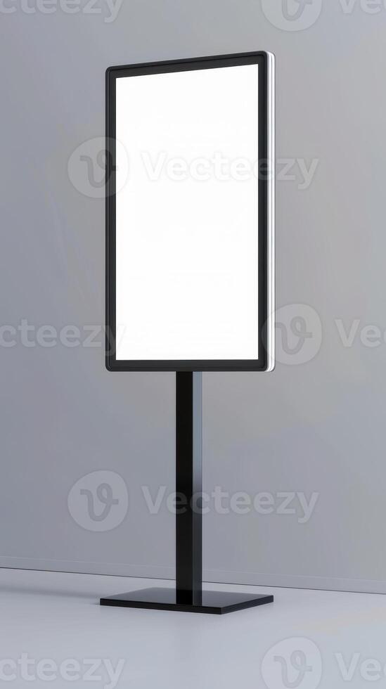 A blank white sign on a stand in front of a gray wall photo