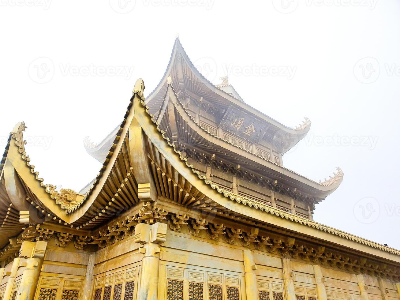 the golden pagoda in the fog photo