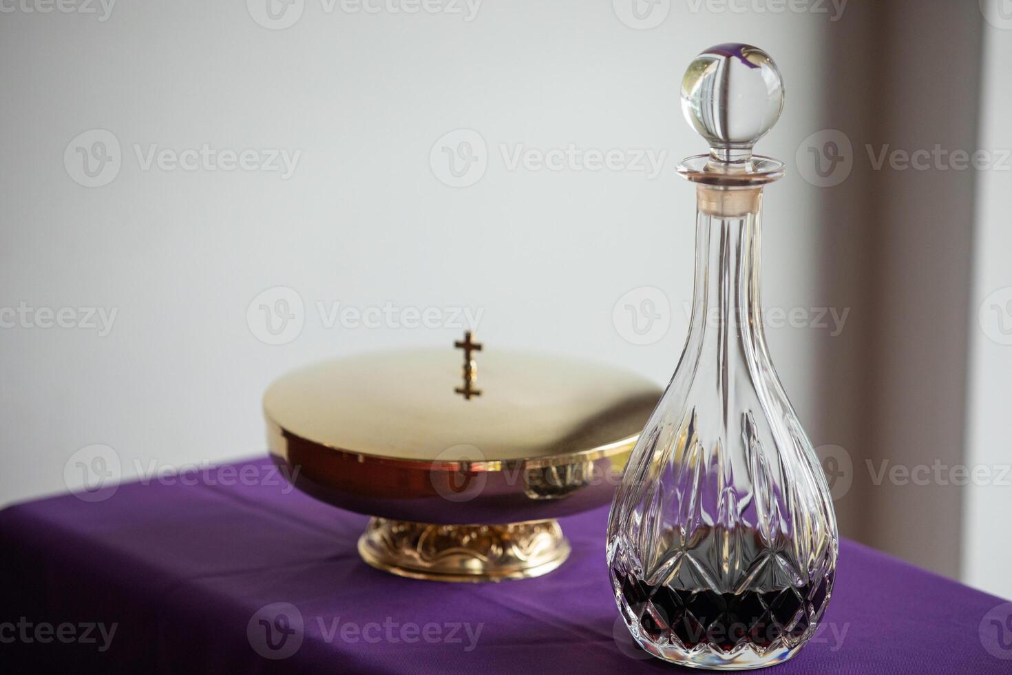 a glass decanter and a bowl on a table photo