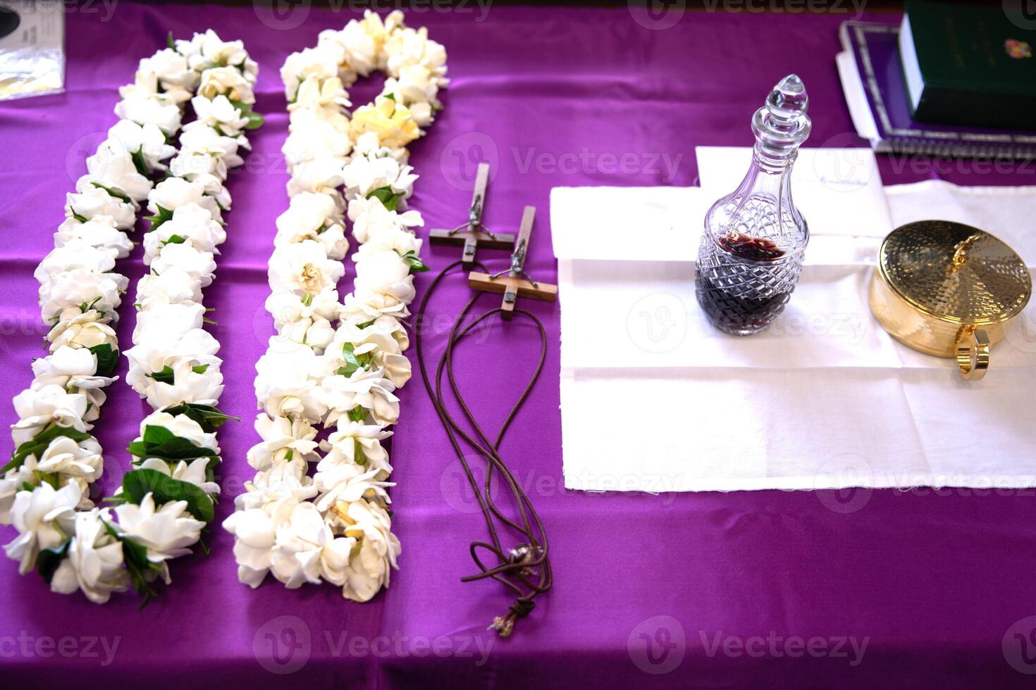 a purple table with flowers and a wine glass photo