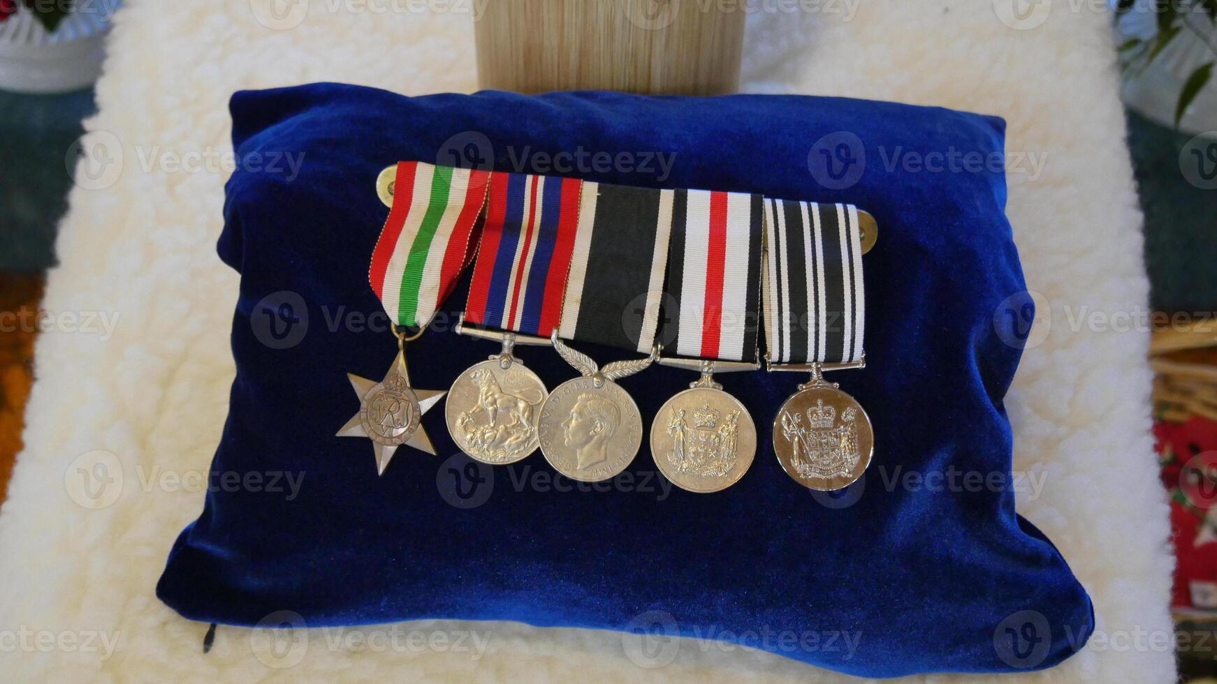 a pillow with medals and ribbons on it photo