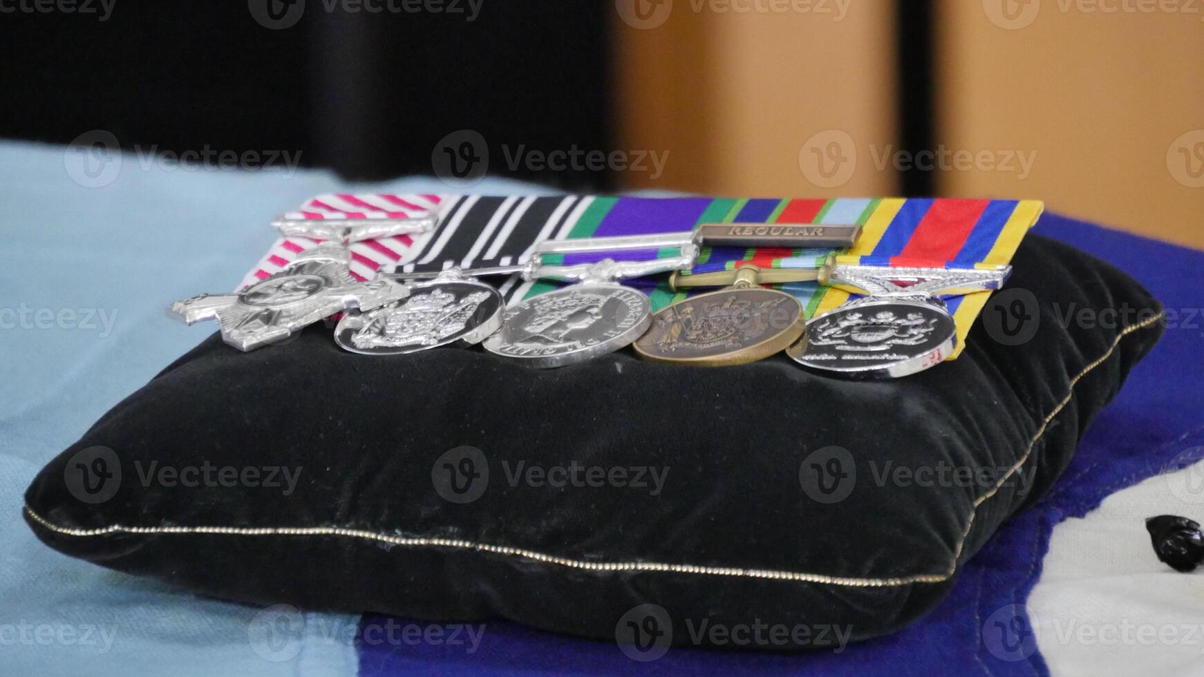 a pillow with medals on it sitting on a table photo